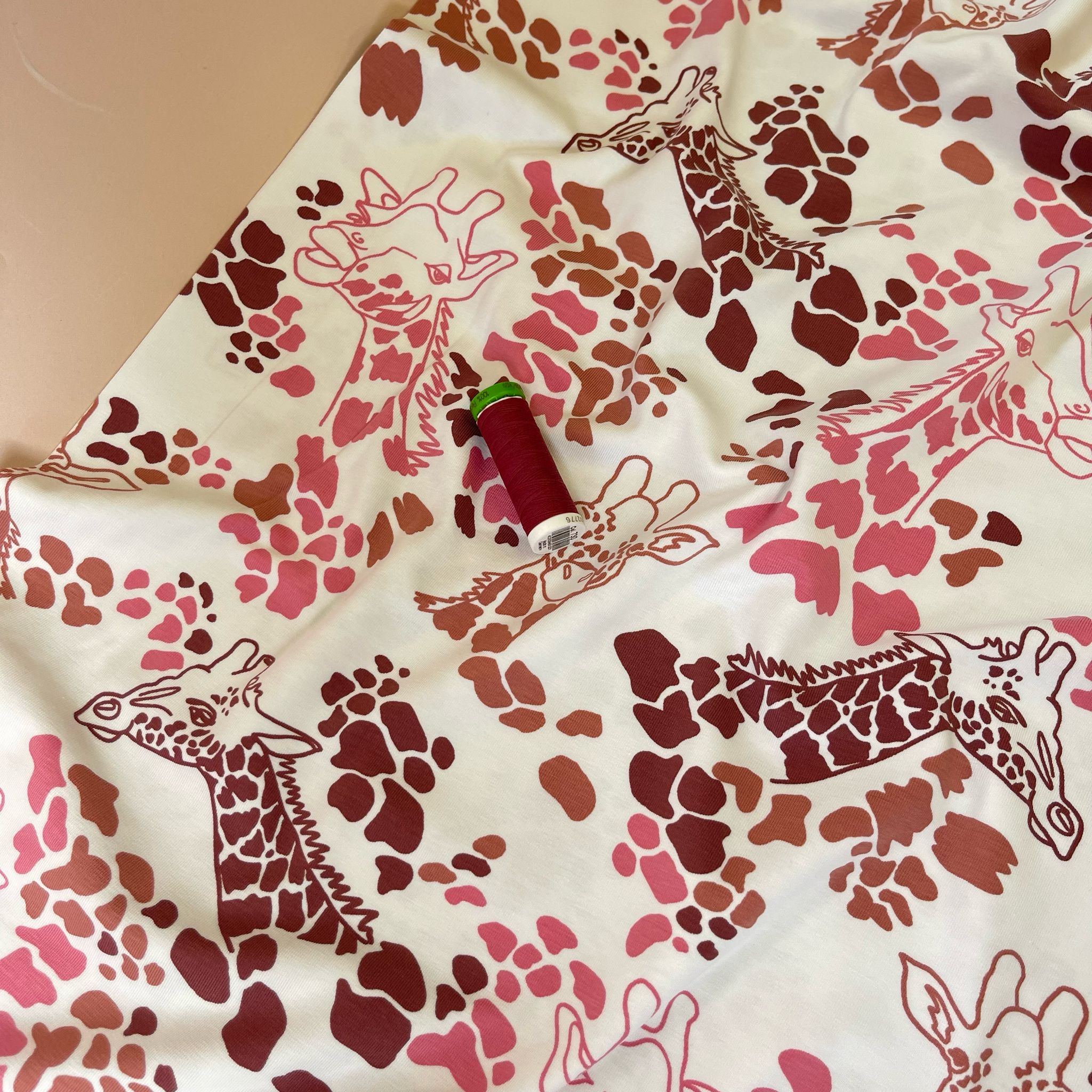 Giraffe's in Red Cotton Jersey Fabric