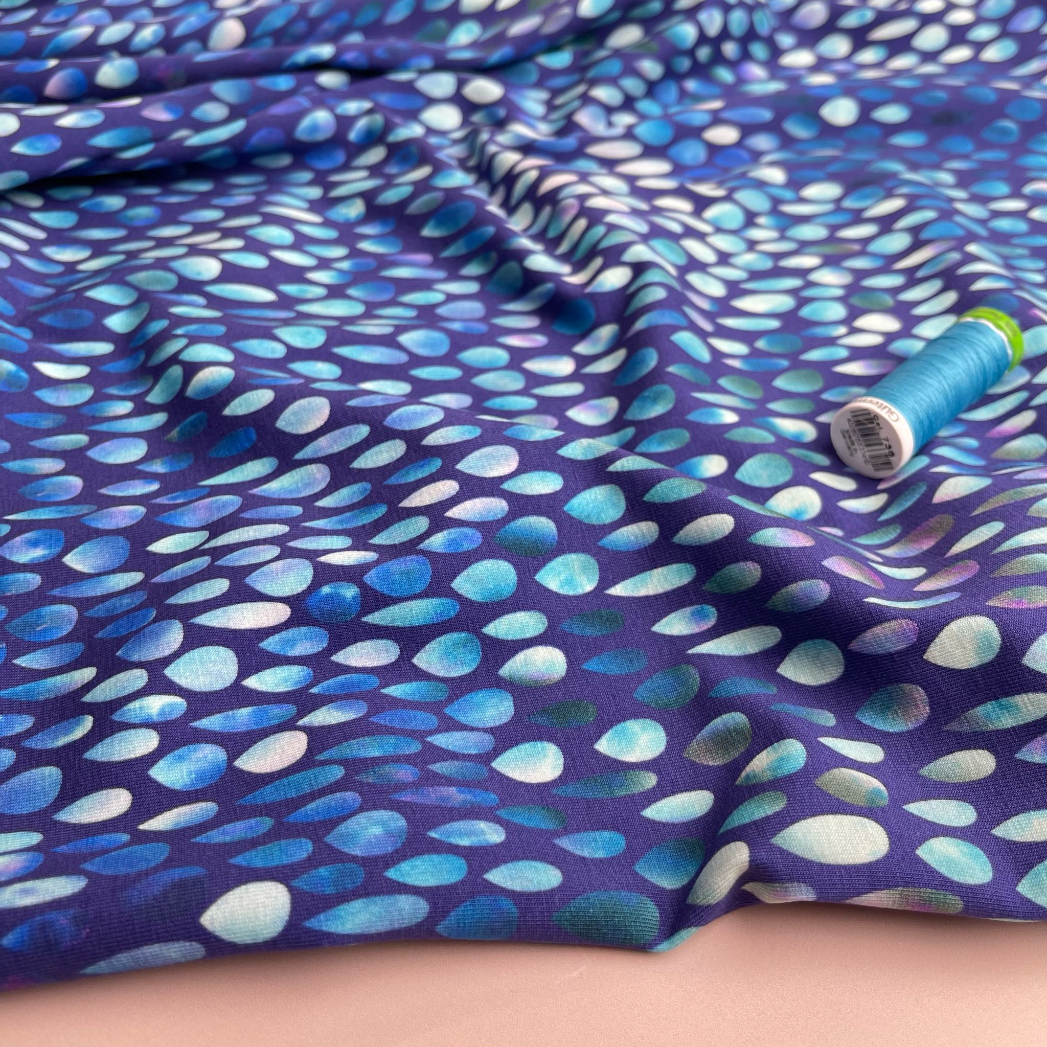 Danish Design - Iridescent Raindrops on Blue Cotton Jersey Fabric