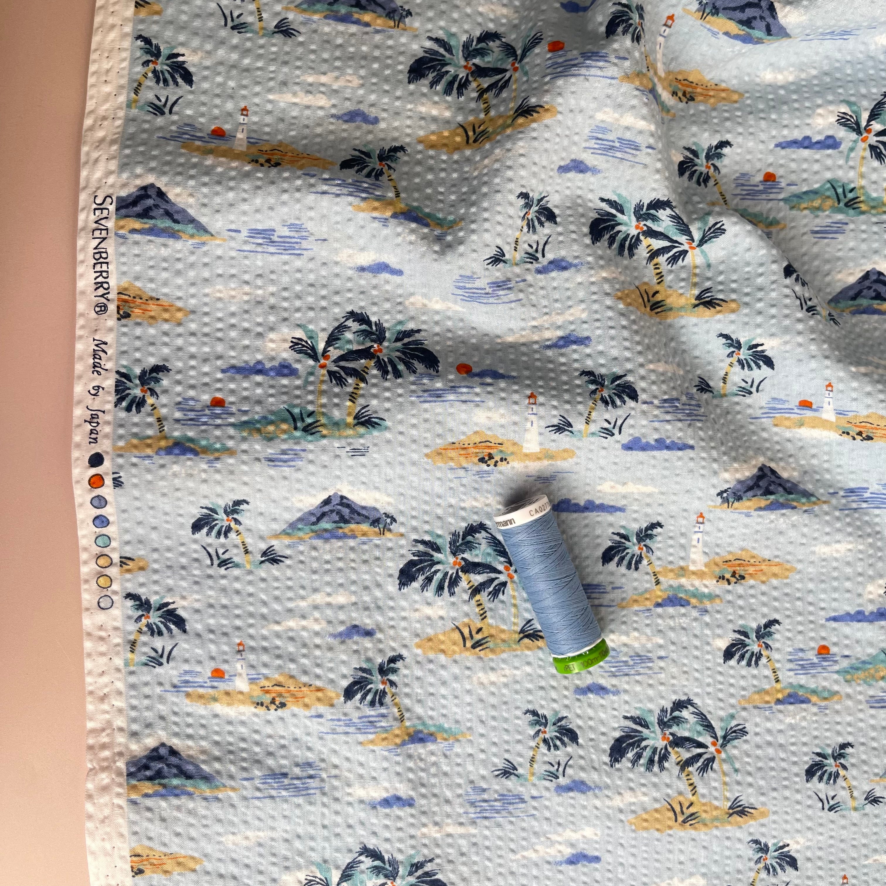 Holiday Islands on Blue Cotton Seersucker Fabric