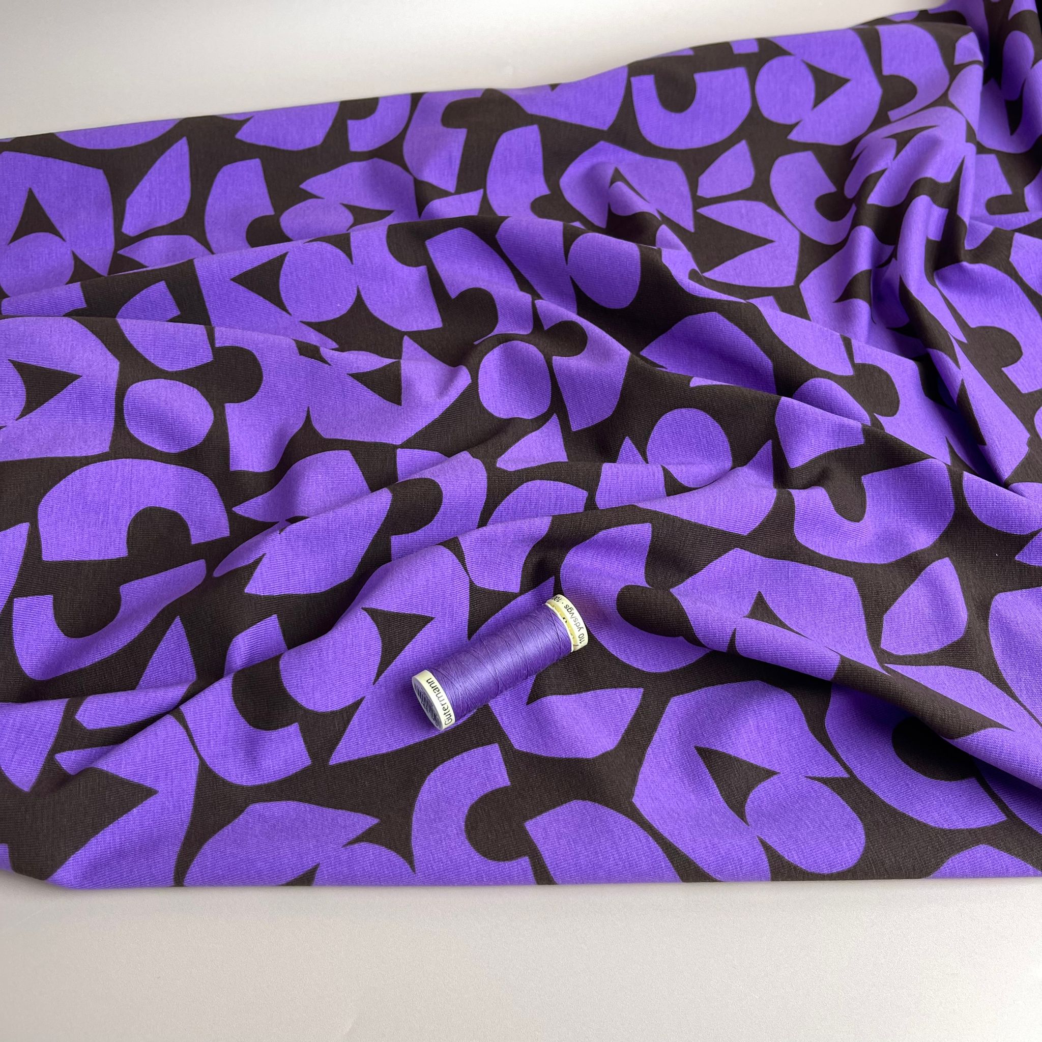 Purple Shapes on Brown Combed Cotton Jersey Fabric