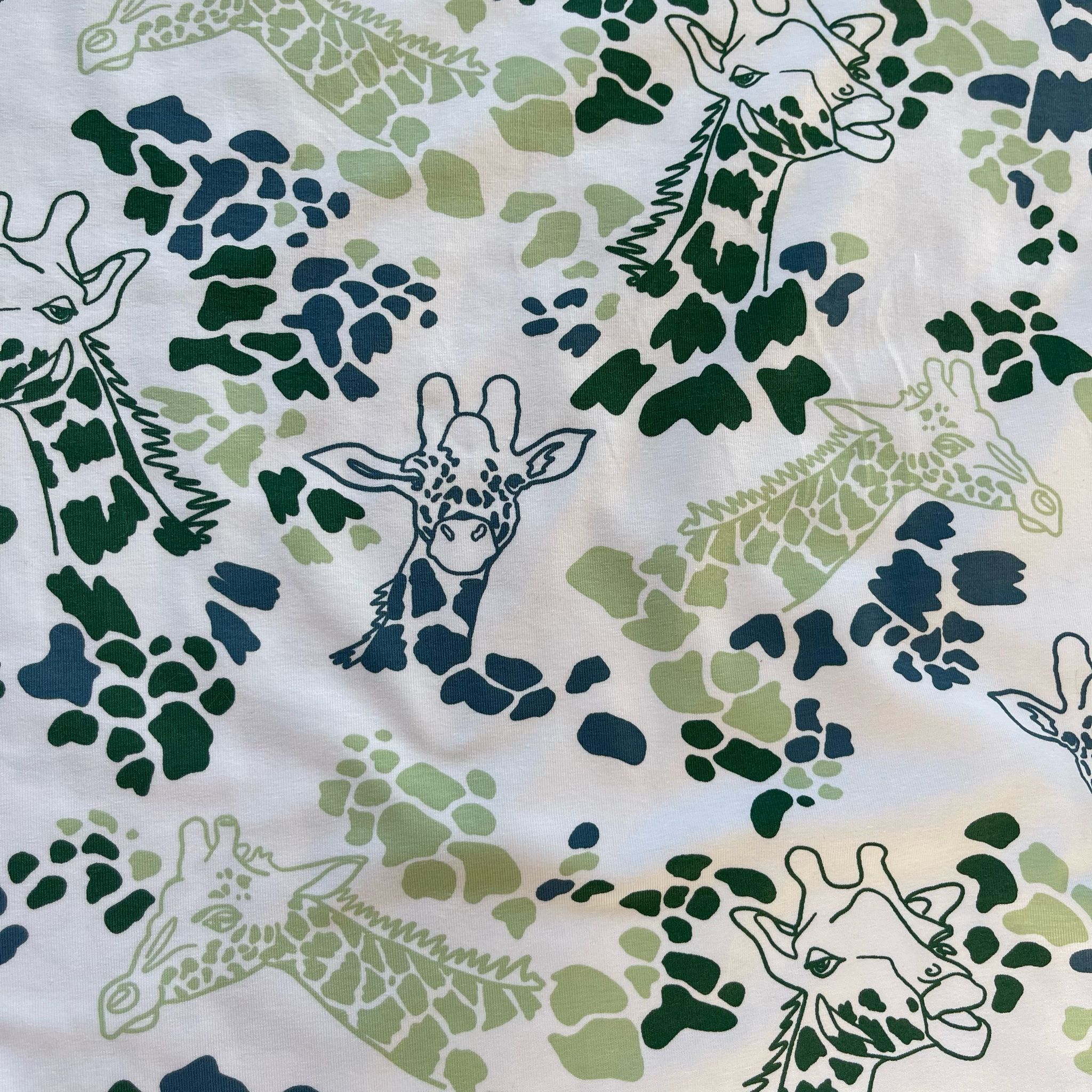 Giraffe's in Green Cotton Jersey Fabric