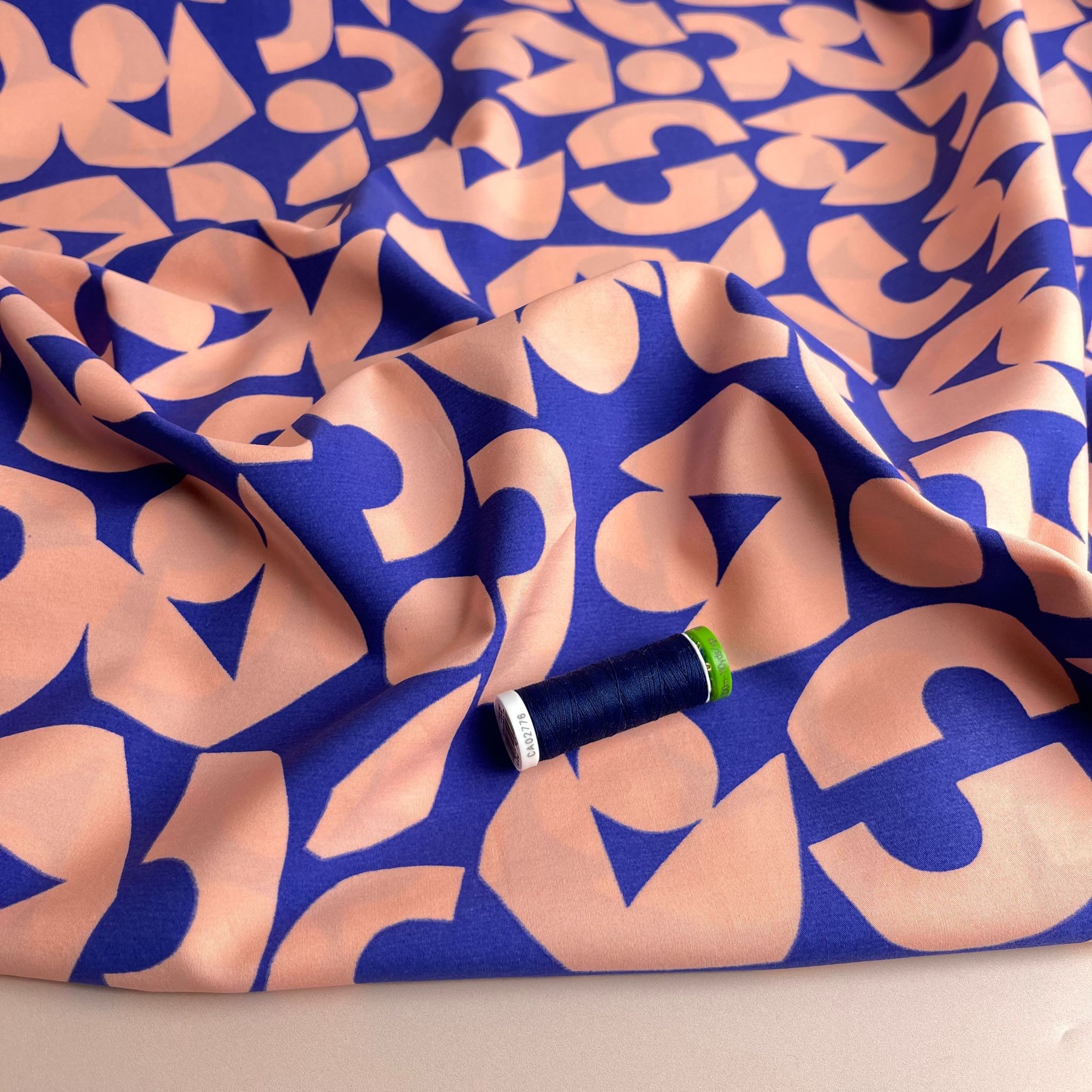 Blush Shapes on Blue Cotton Poplin Fabric