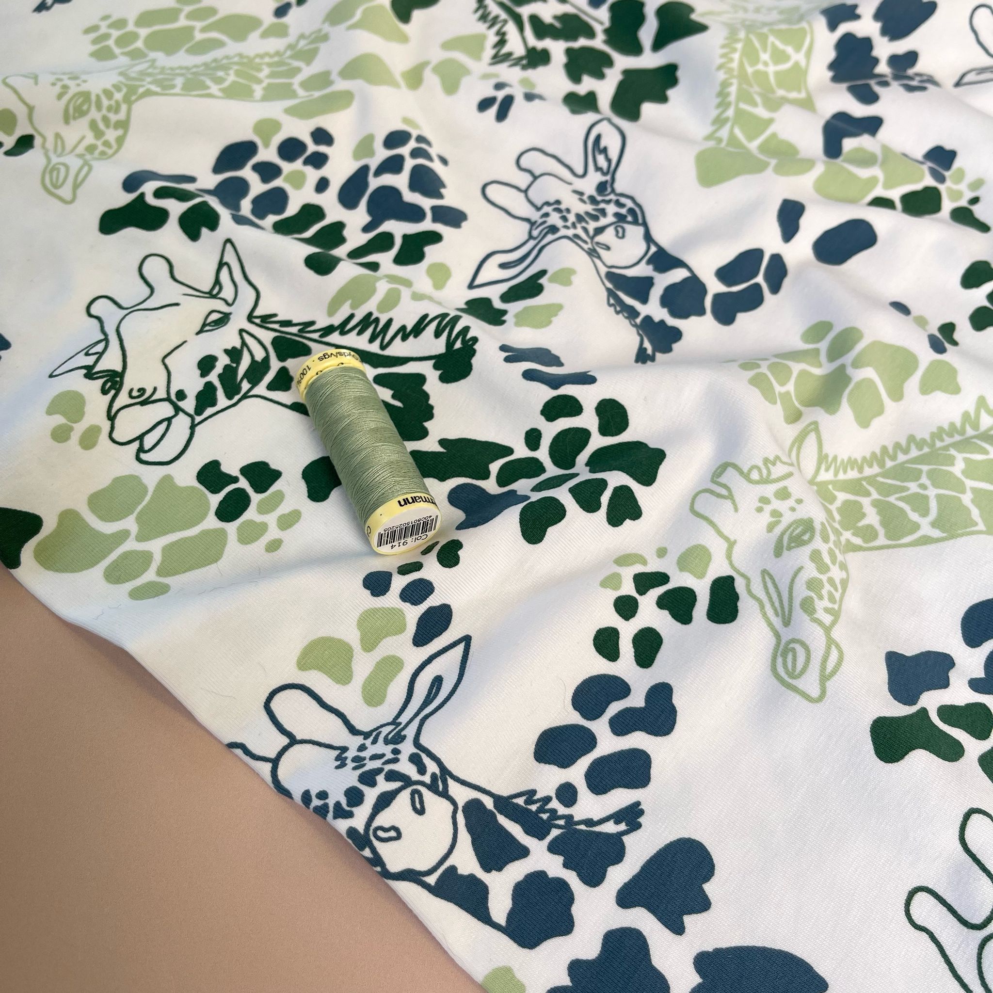 Giraffe's in Green Cotton Jersey Fabric