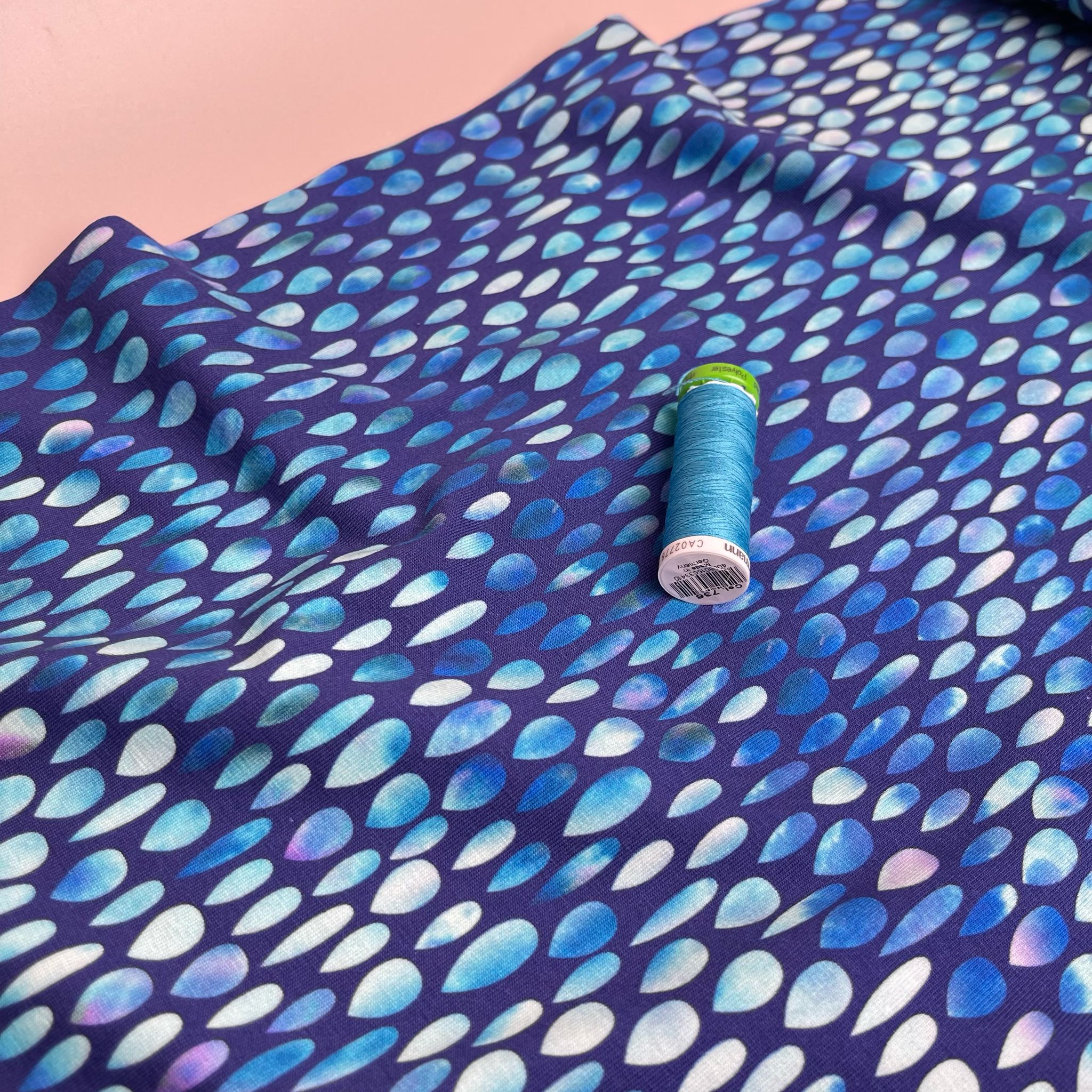 Danish Design - Iridescent Raindrops on Blue Cotton Jersey Fabric