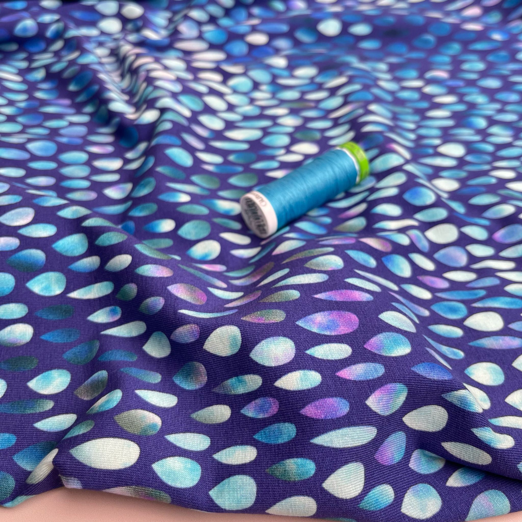 Danish Design - Iridescent Raindrops on Blue Cotton Jersey Fabric