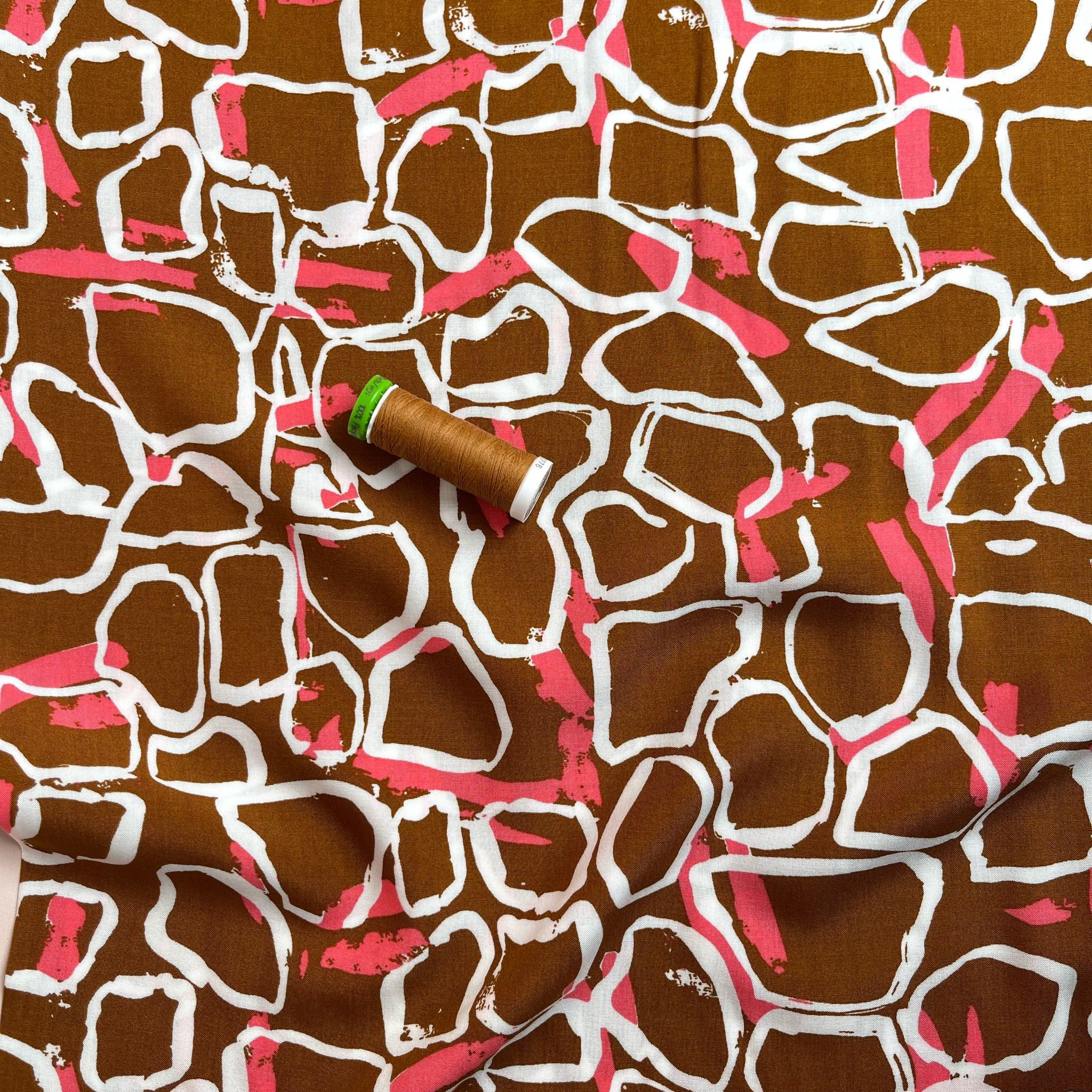 White Shapes on Brown Viscose Fabric