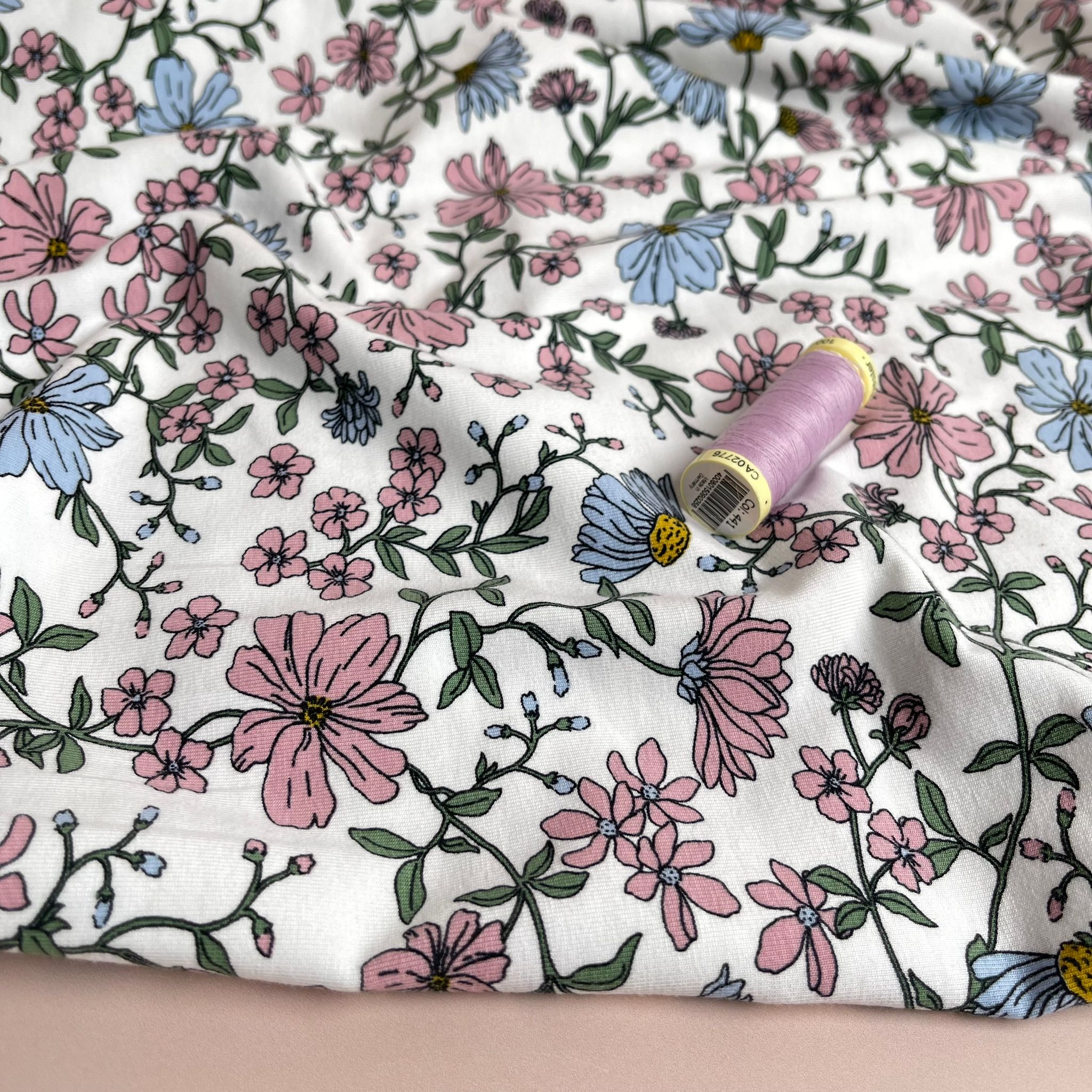 Pink Flowers on White Cotton Jersey Fabric