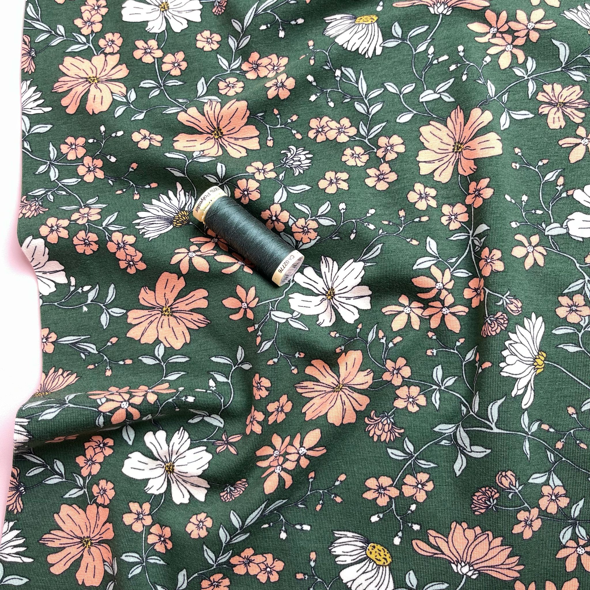 Peach Flowers on Green Cotton Jersey Fabric