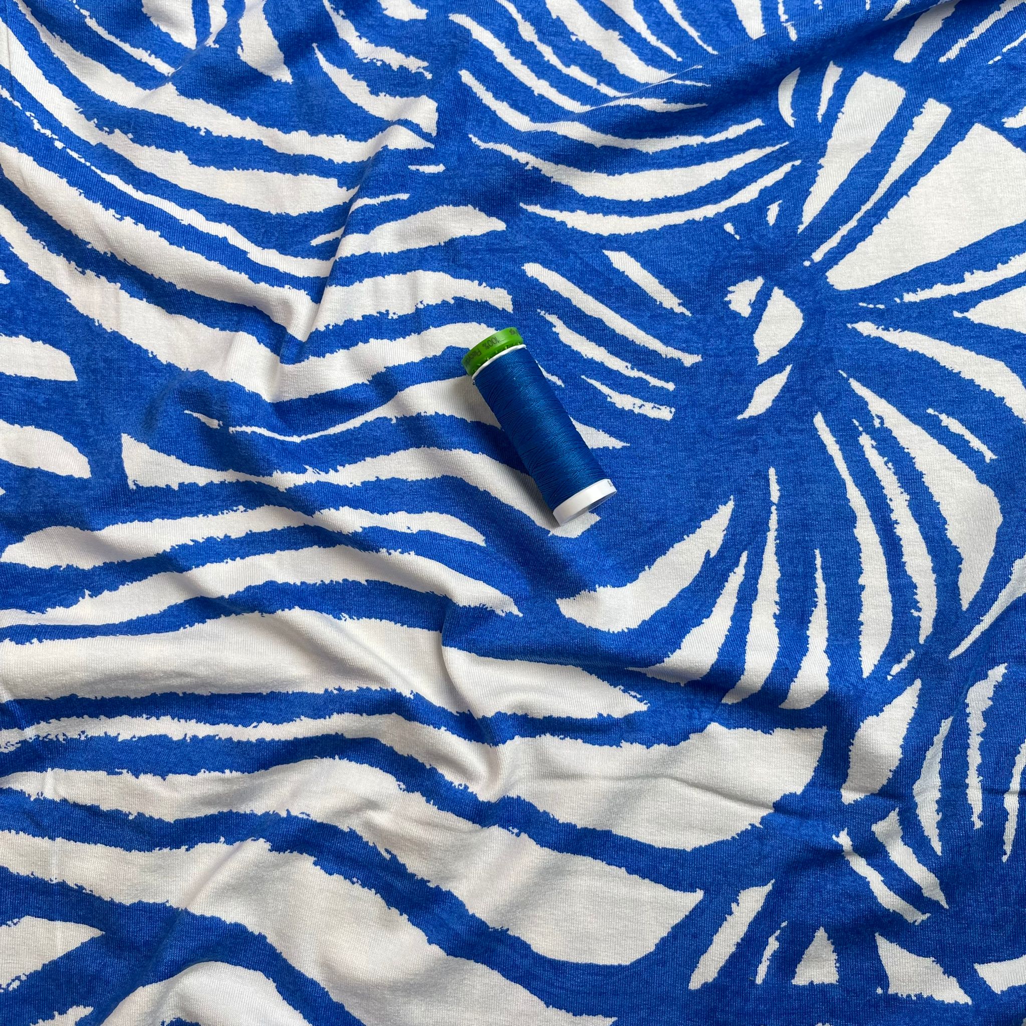 Ex-Designer Deadstock Ammonite Fossils on Blue Viscose Jersey Fabric