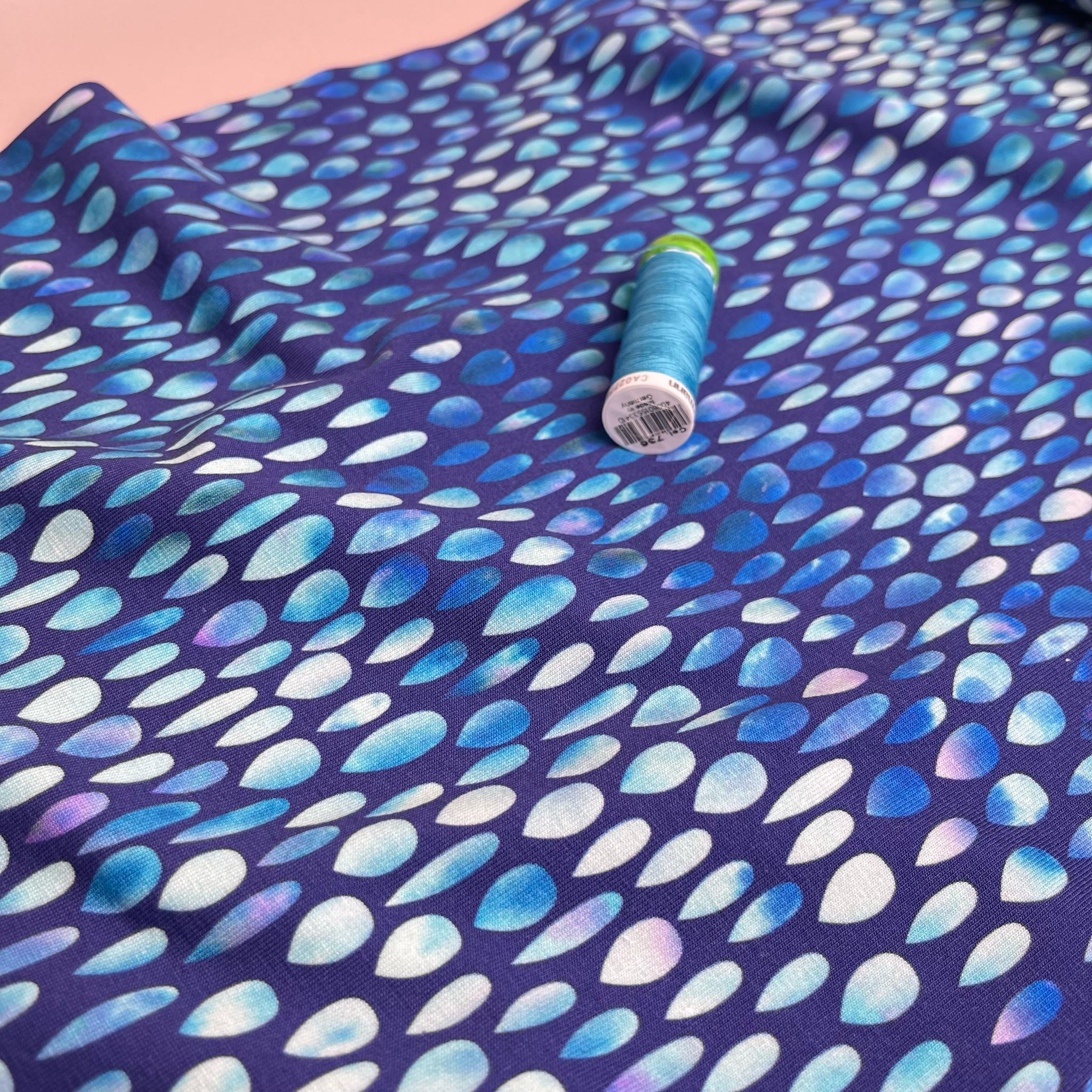 Danish Design - Iridescent Raindrops on Blue Cotton Jersey Fabric