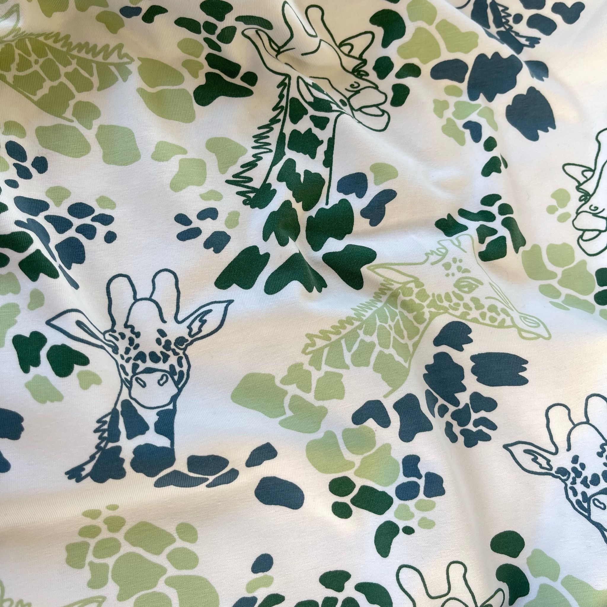 Giraffe's in Green Cotton Jersey Fabric