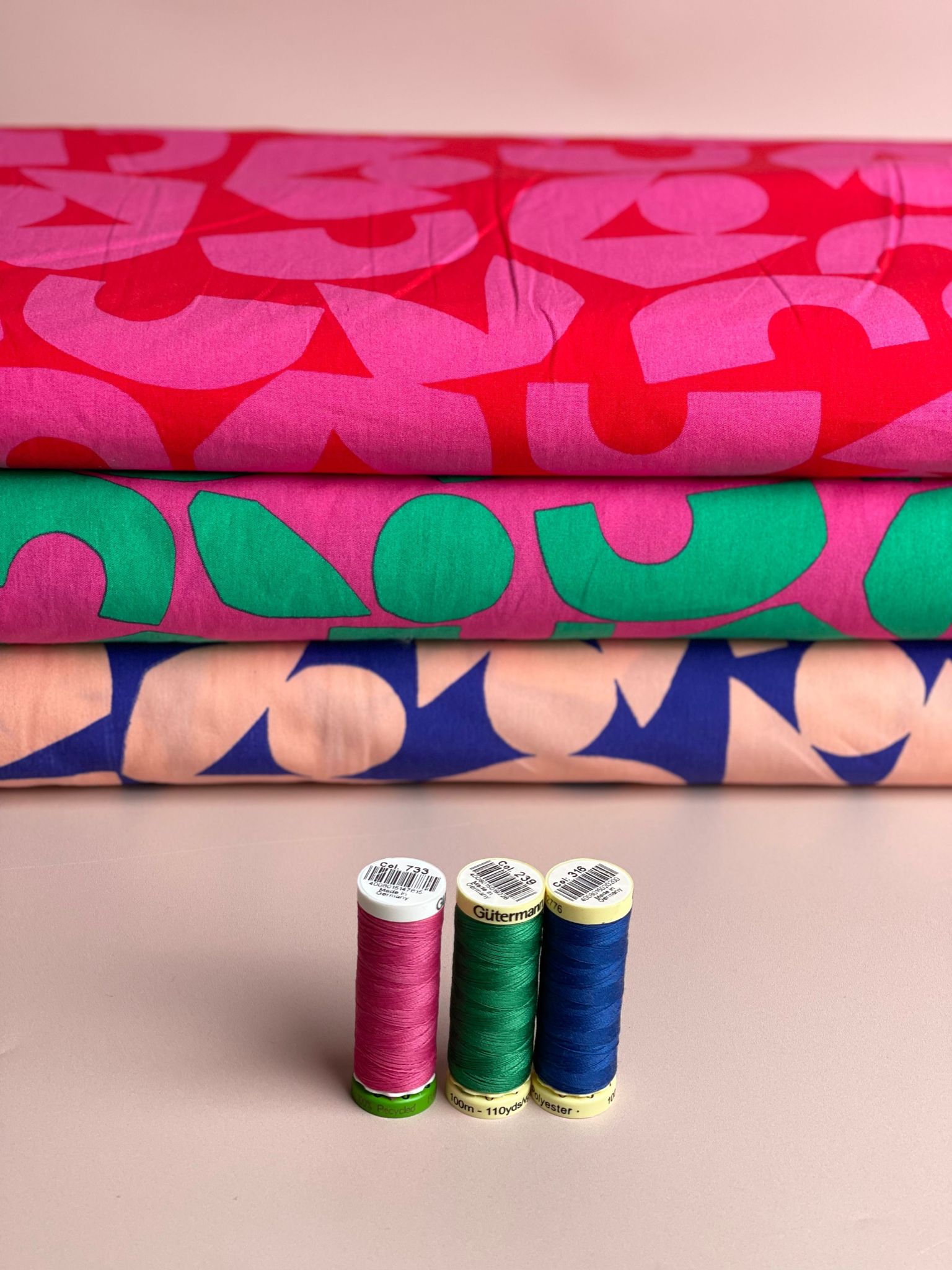 Blush Shapes on Blue Cotton Poplin Fabric