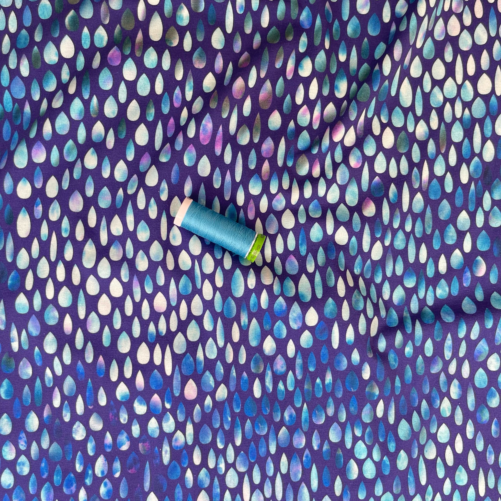 Danish Design - Iridescent Raindrops on Blue Cotton Jersey Fabric