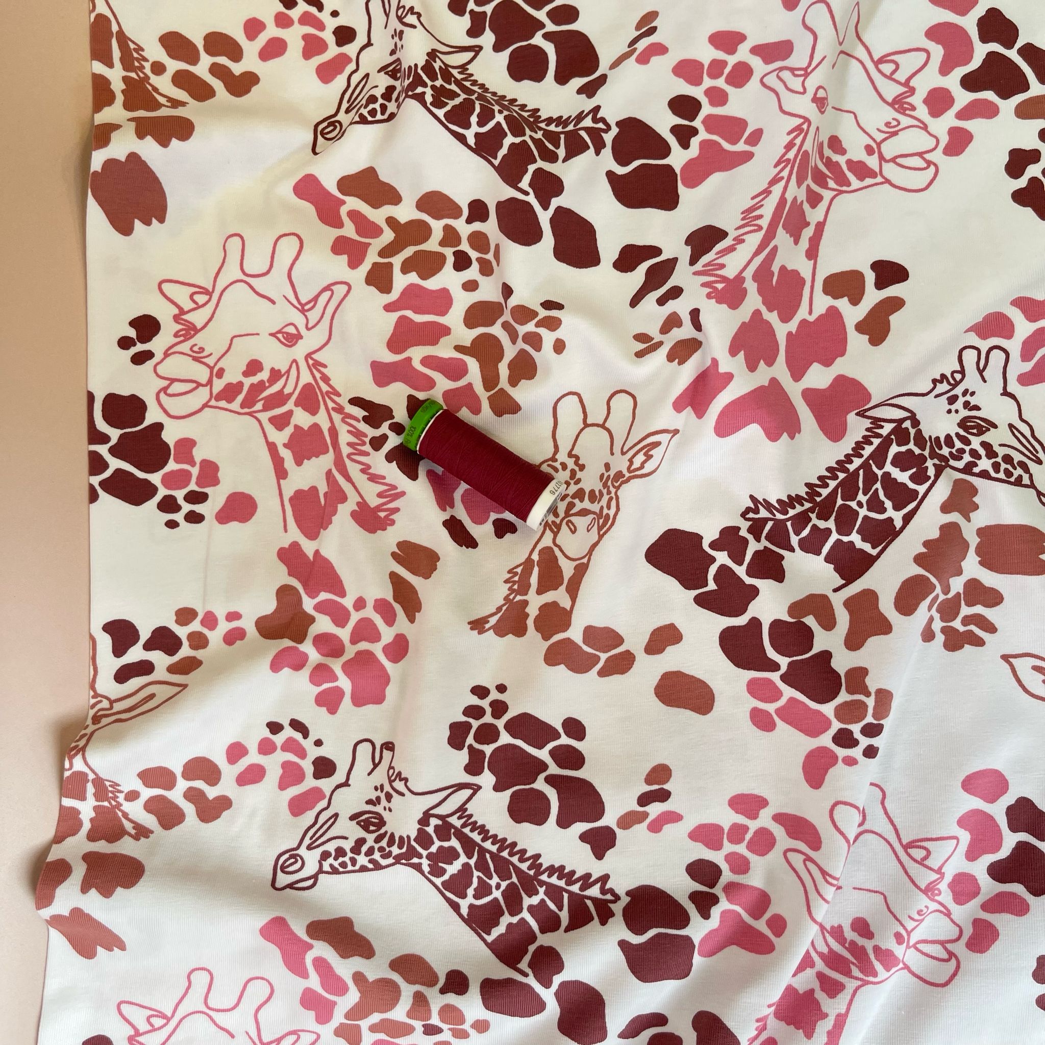 Giraffe's in Red Cotton Jersey Fabric