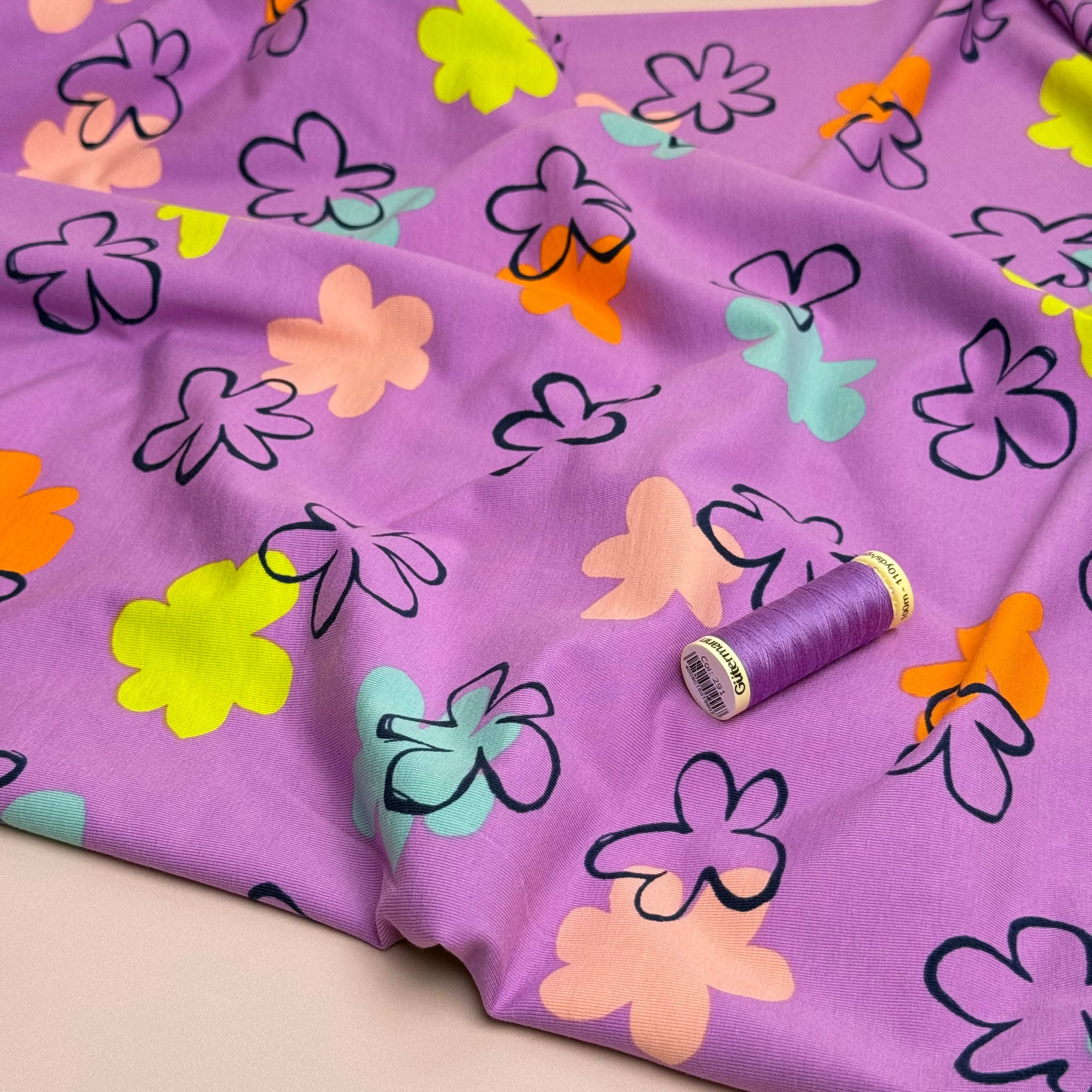 Flower Stamps on Lilac Cotton Jersey Fabric