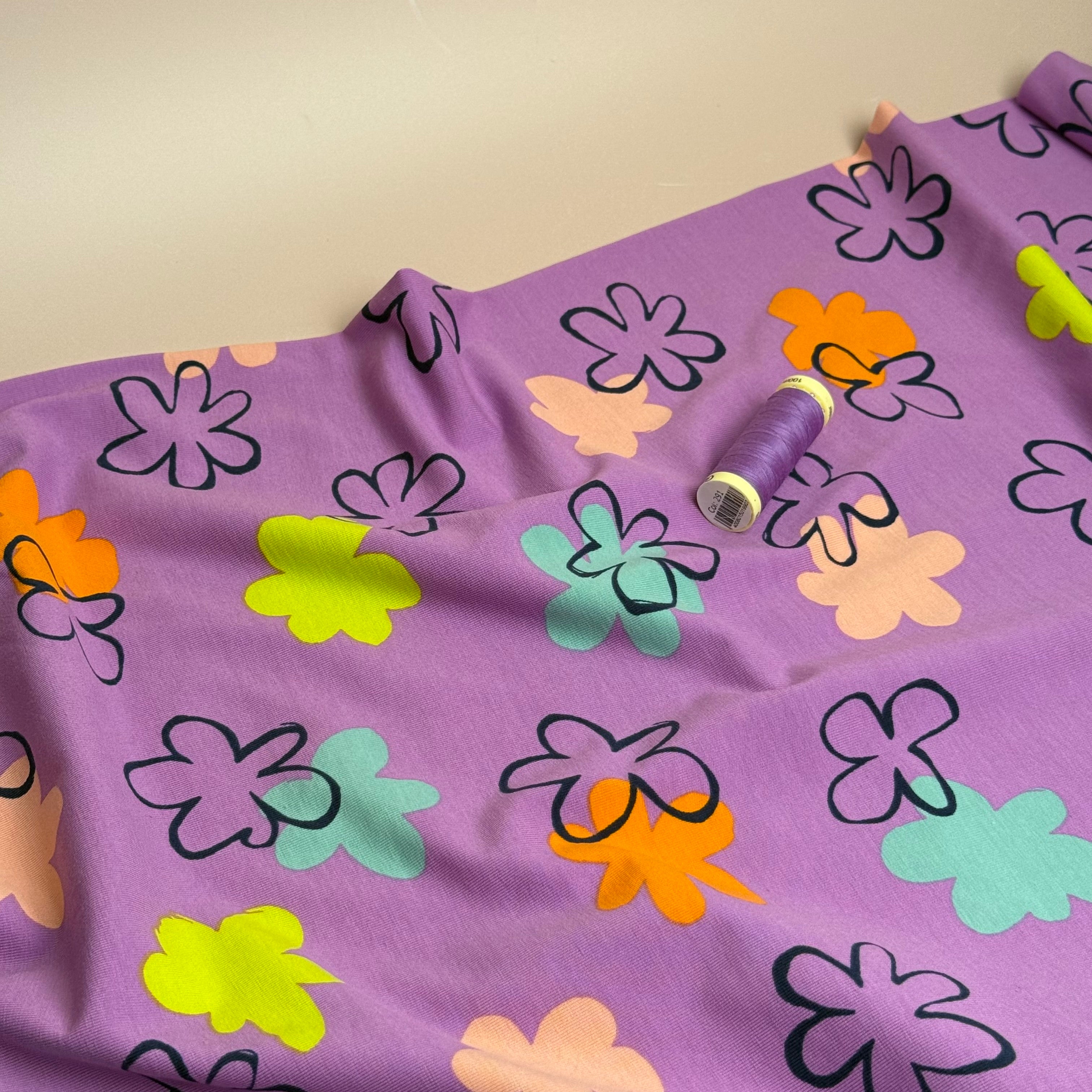 Flower Stamps on Lilac Cotton Jersey Fabric