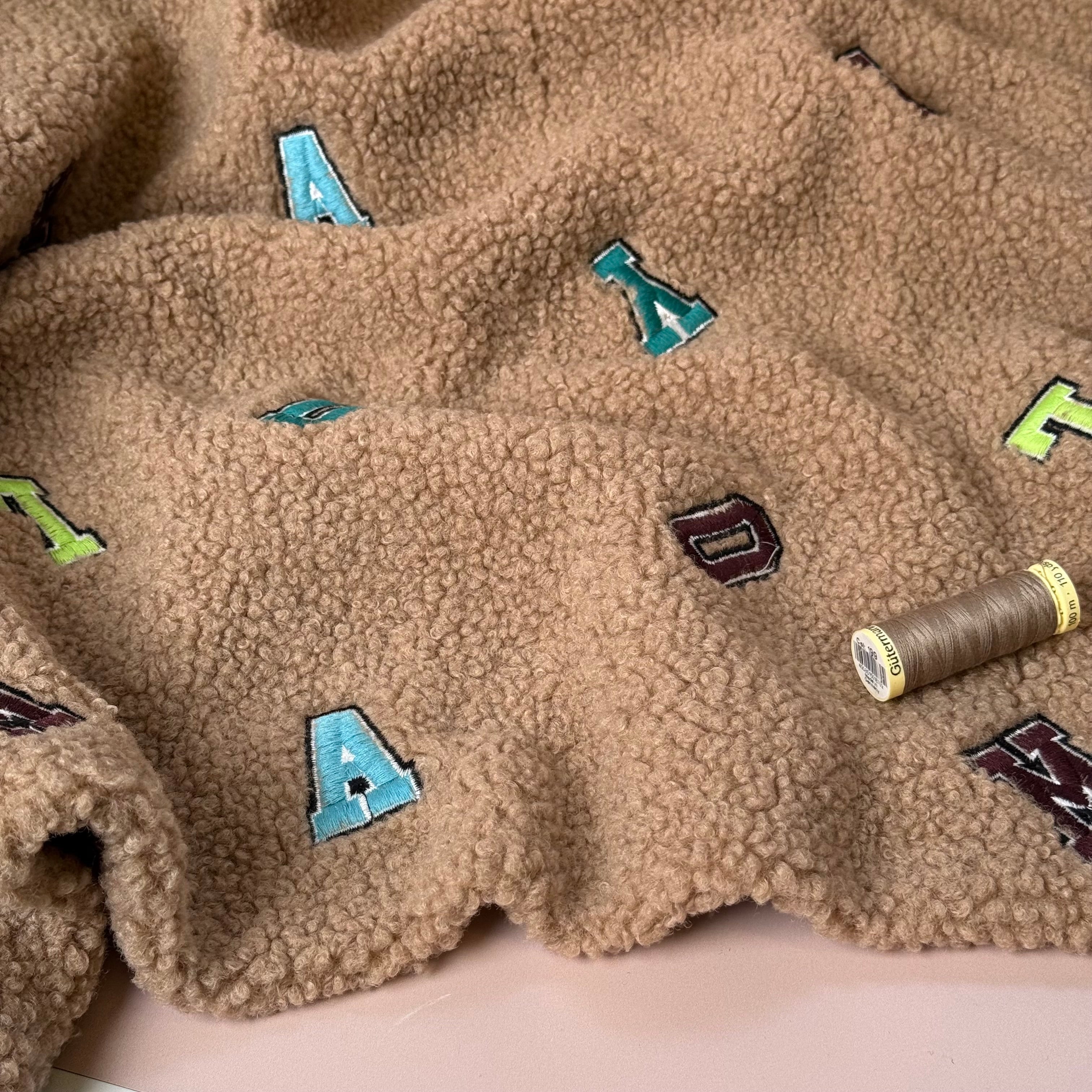 Teddy Boucle with Embroidered Letters Coating Fabric