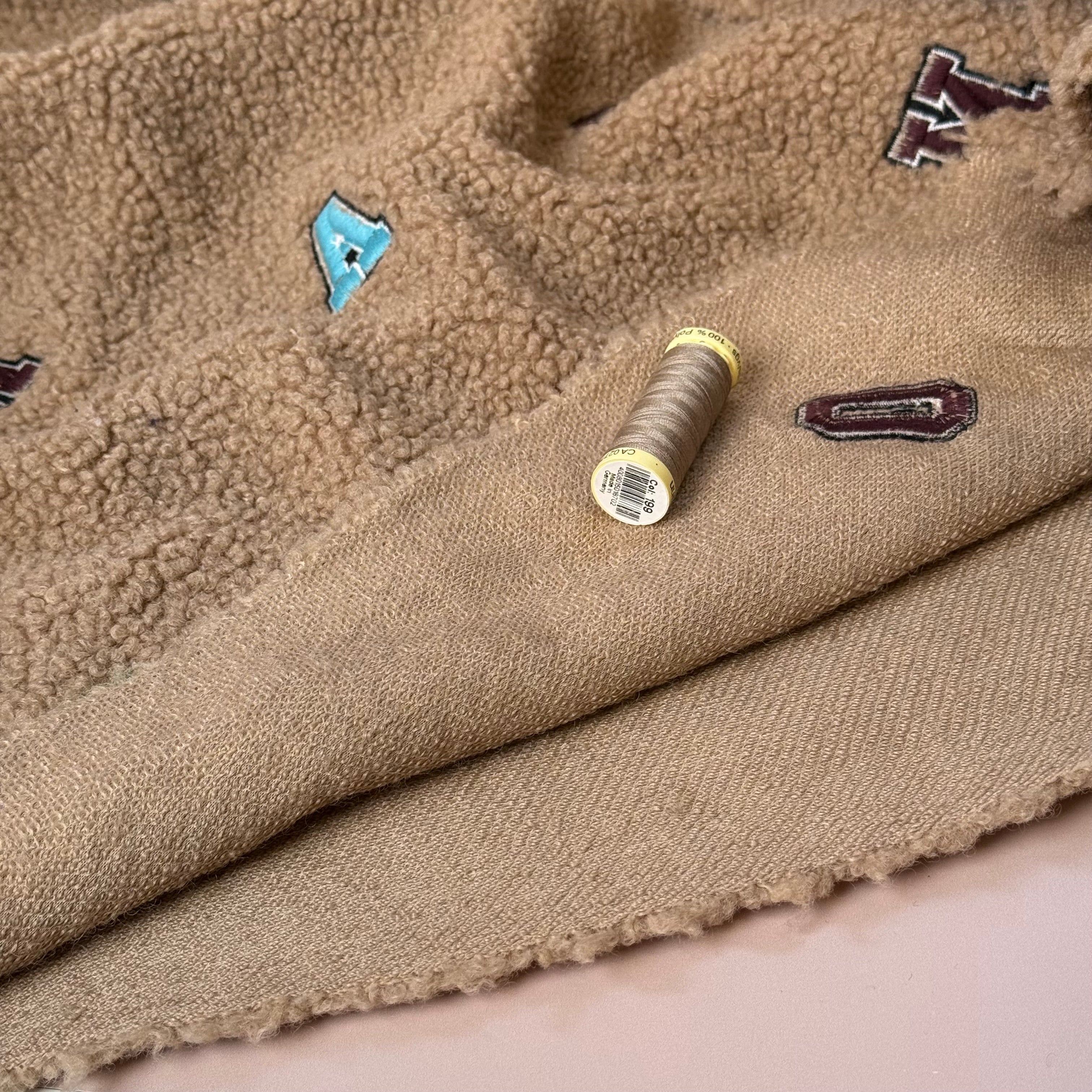Teddy Boucle with Embroidered Letters Coating Fabric