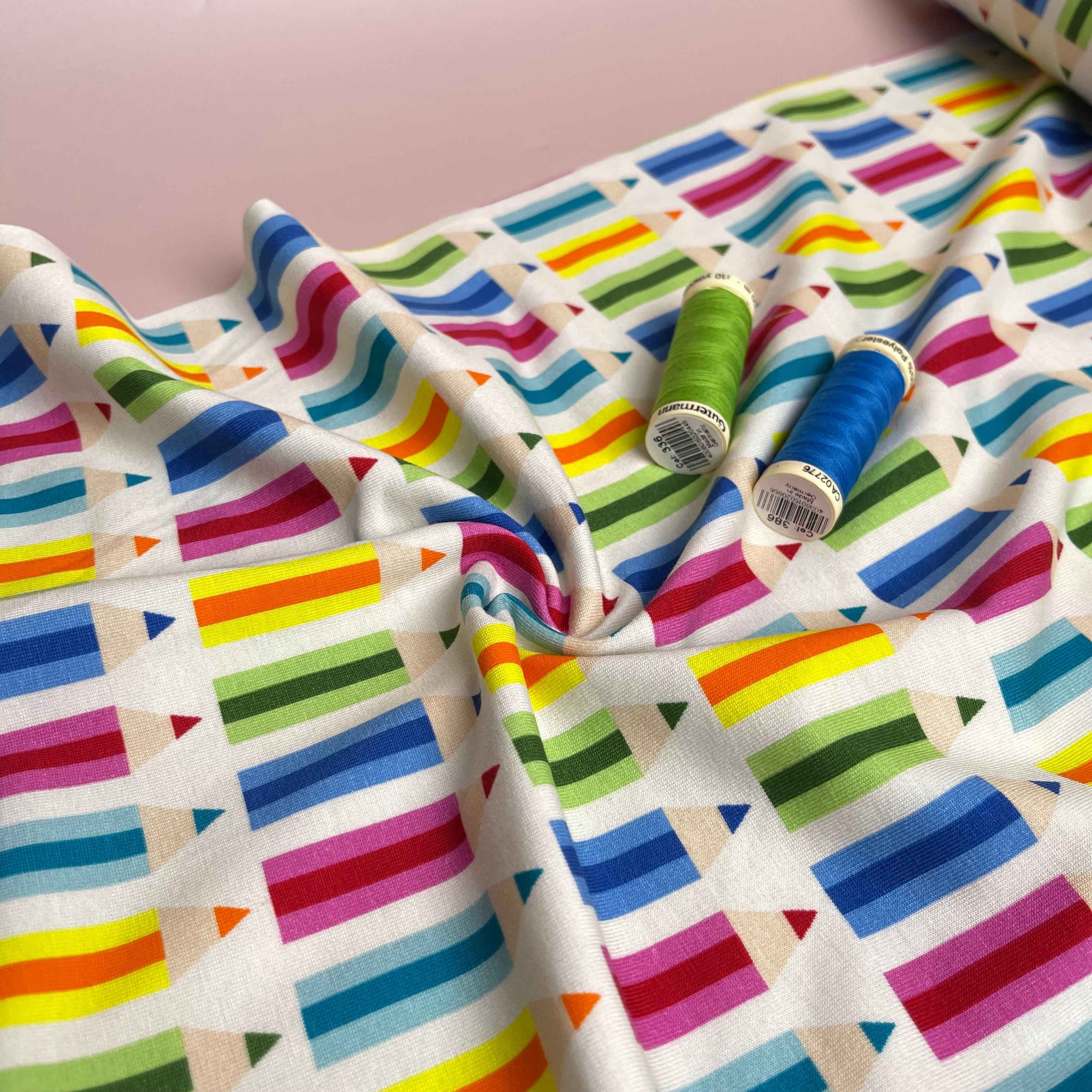 Rainbow Pencils on White Cotton Jersey Fabric