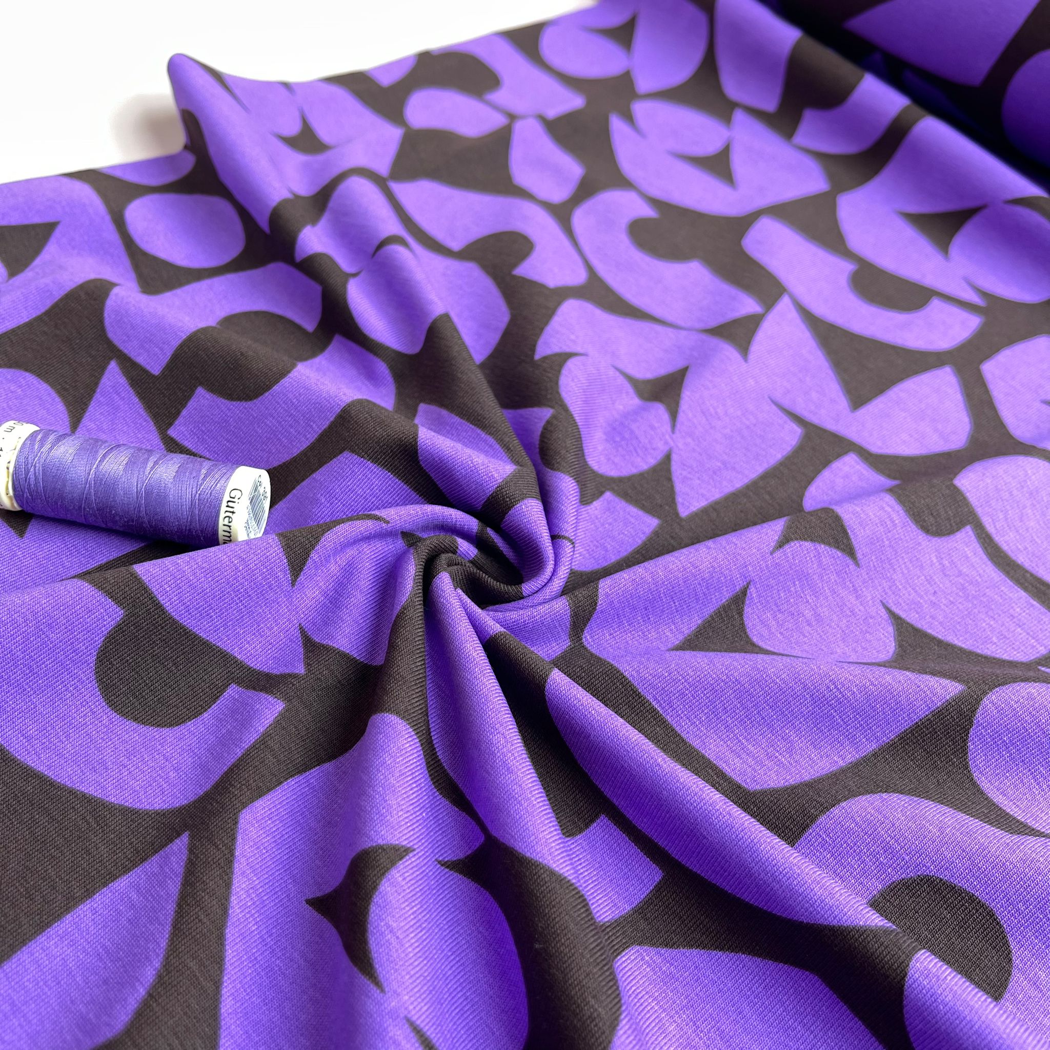 Purple Shapes on Brown Combed Cotton Jersey Fabric
