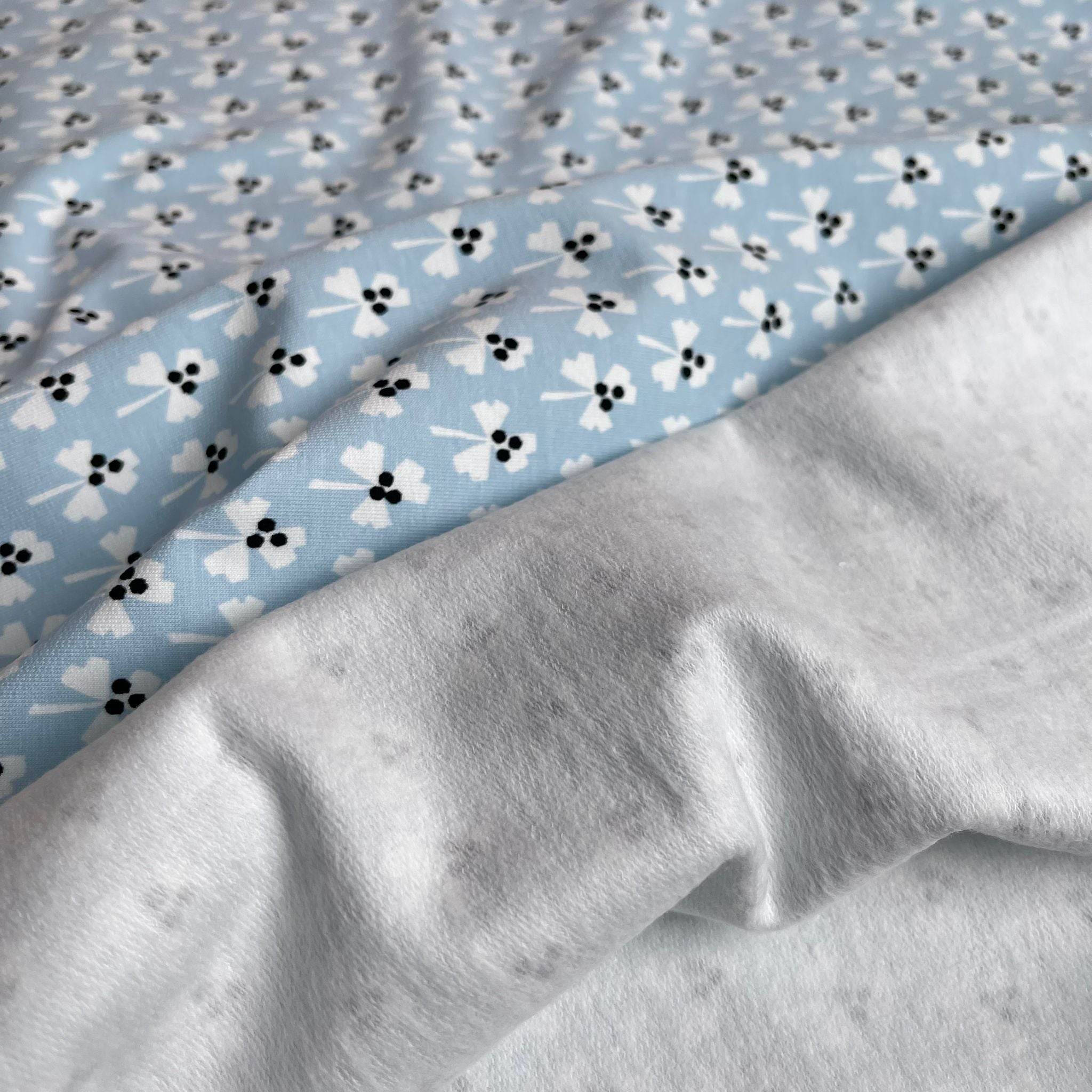REMNANT 1.27 metres + free 14cm fault - Monochrome Clovers on Pale Blue Cotton French Terry