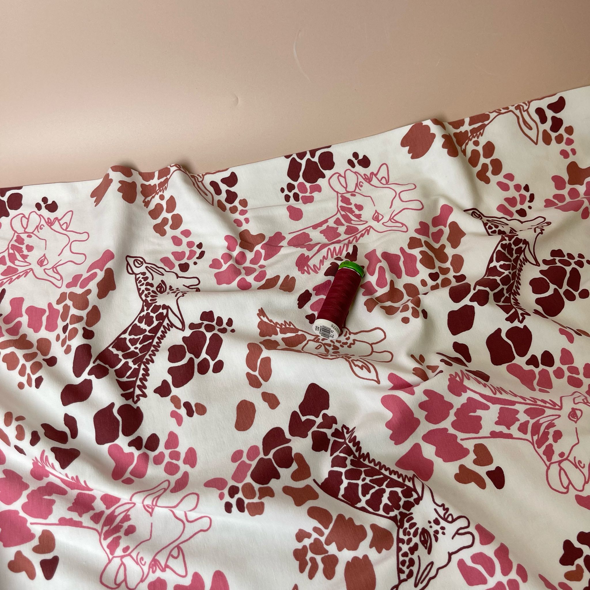 Giraffe's in Red Cotton Jersey Fabric