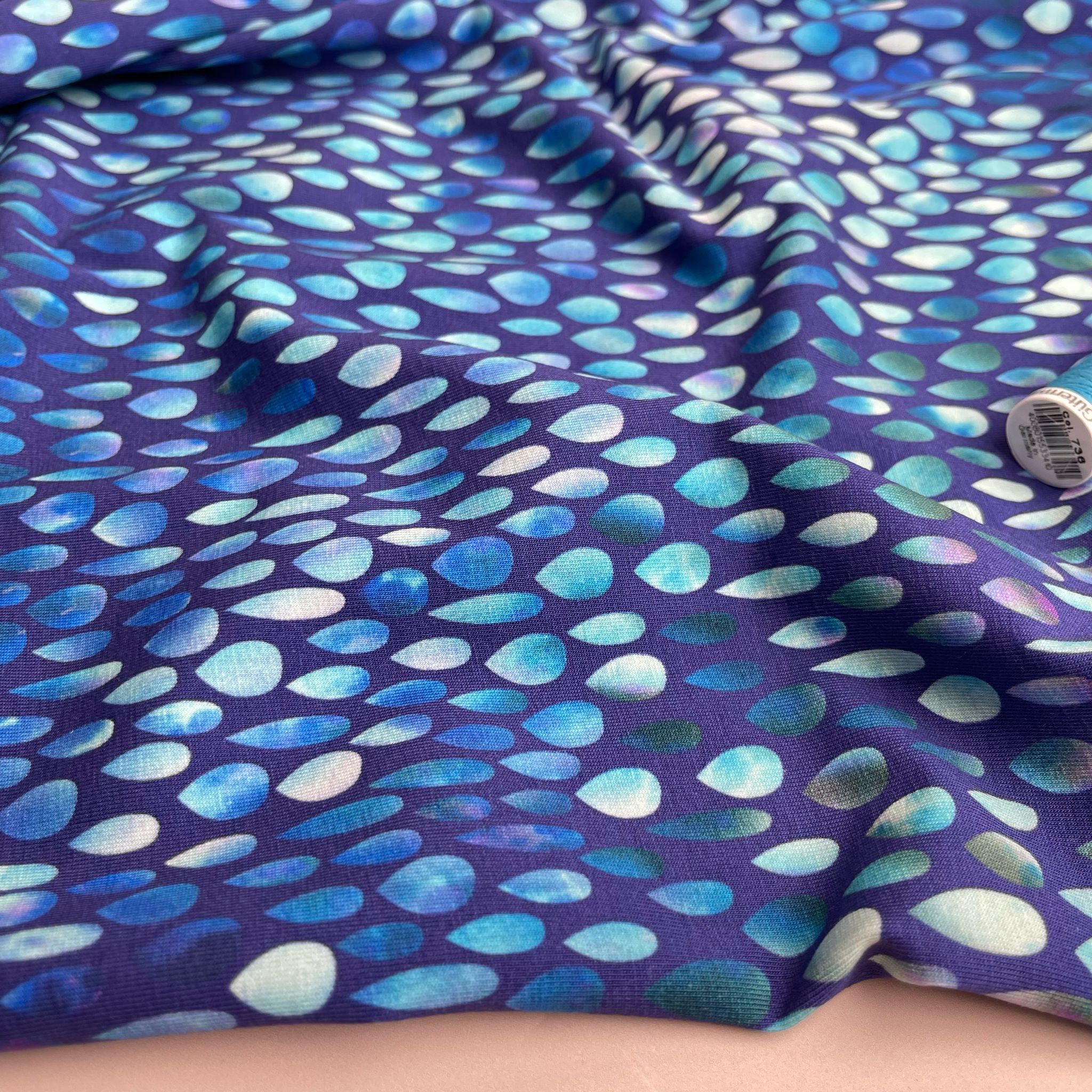 Danish Design - Iridescent Raindrops on Blue Cotton Jersey Fabric