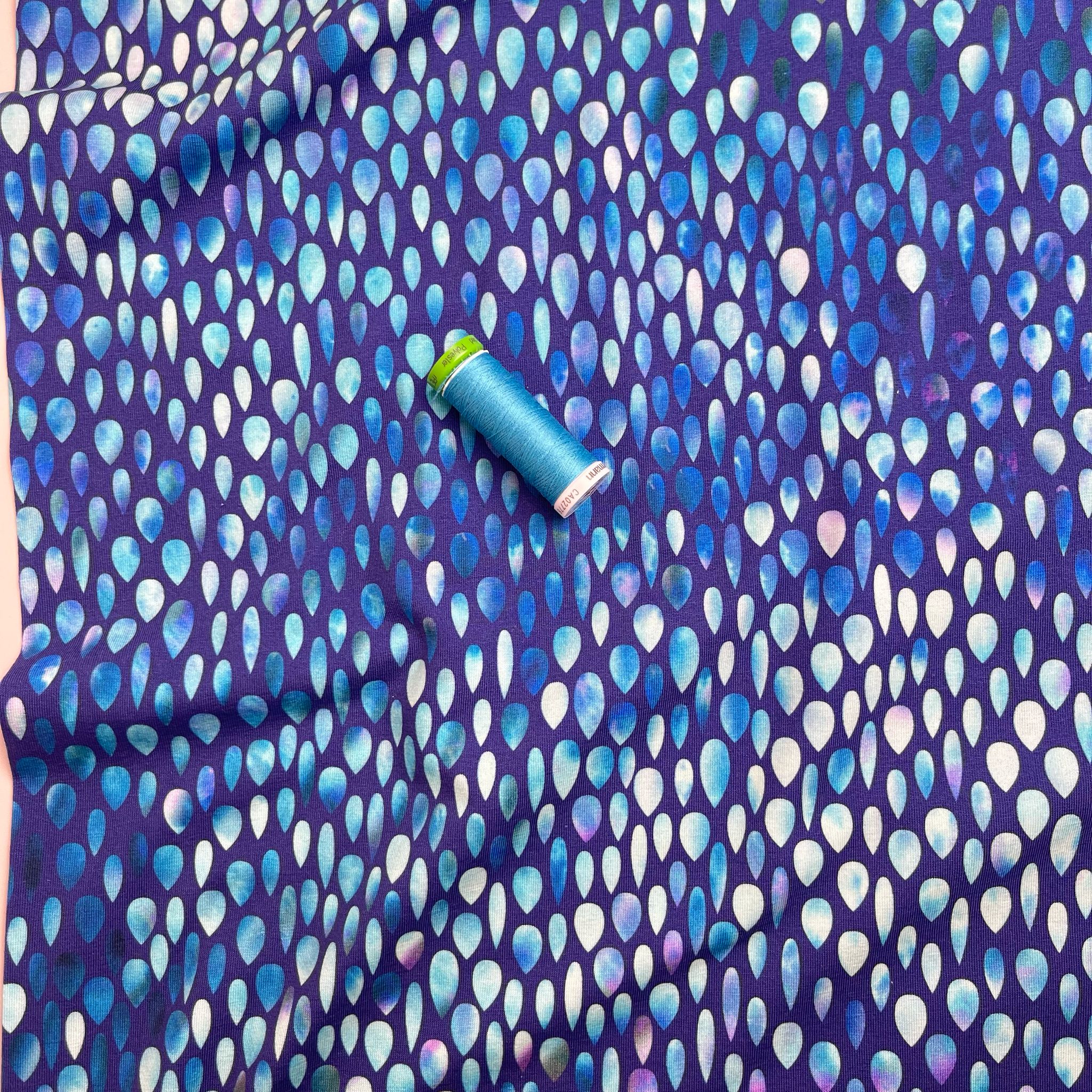 Danish Design - Iridescent Raindrops on Blue Cotton Jersey Fabric
