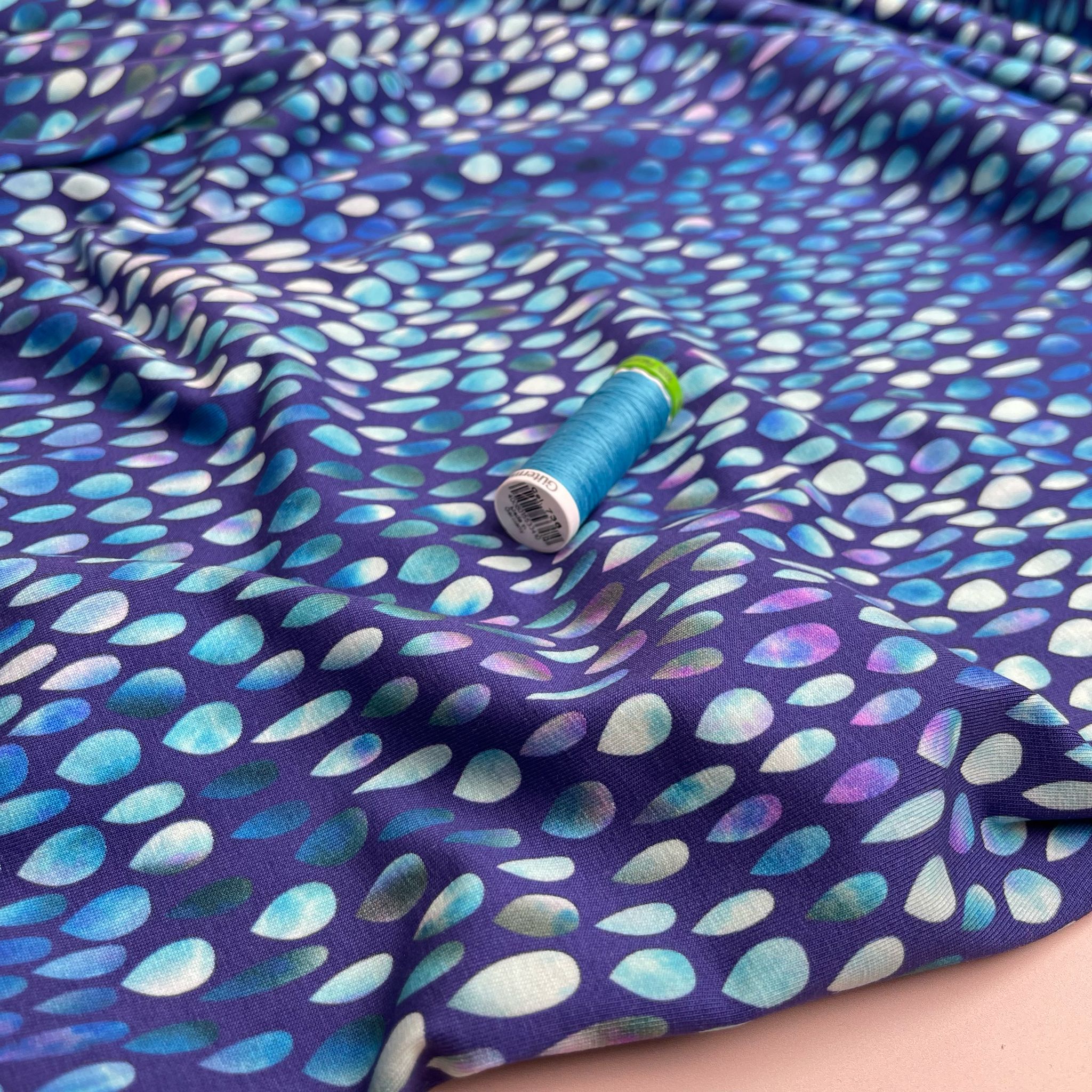 Danish Design - Iridescent Raindrops on Blue Cotton Jersey Fabric