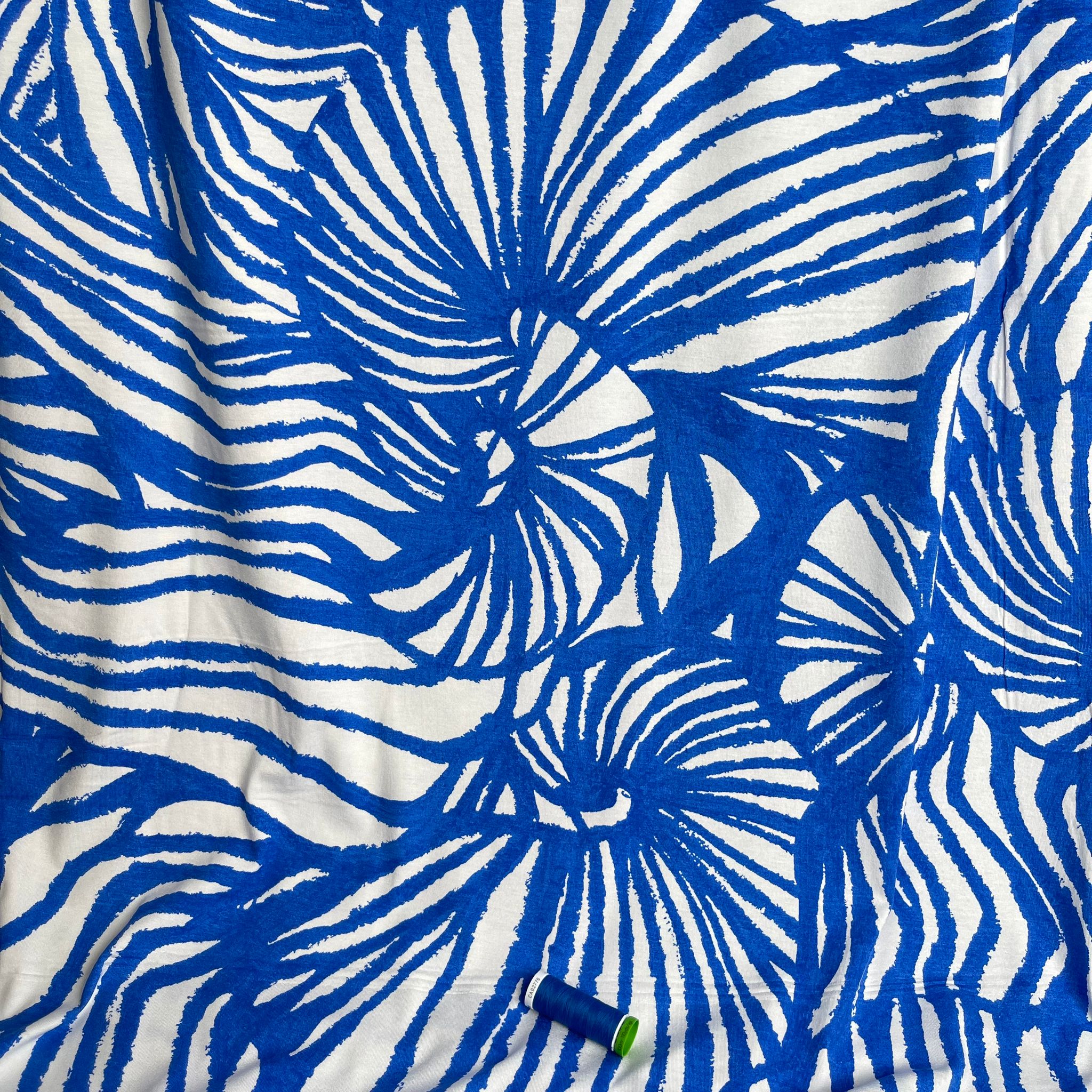 Ex-Designer Deadstock Ammonite Fossils on Blue Viscose Jersey Fabric