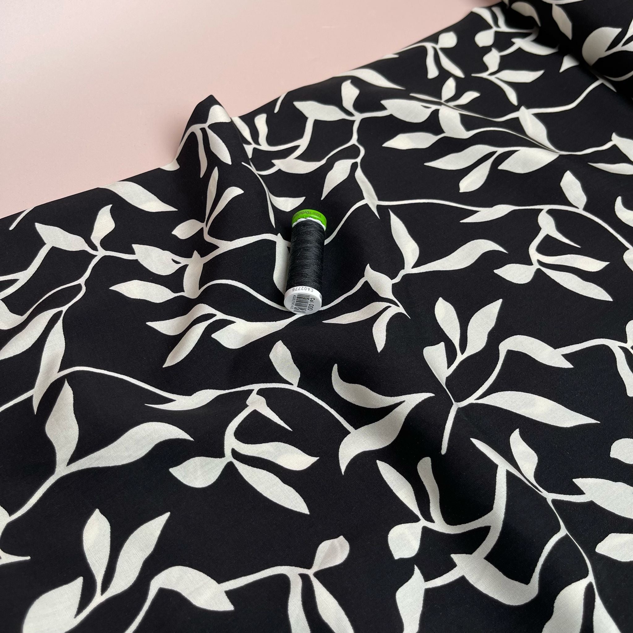 REMNANT 0.46 Metres - White Leaves on Black Viscose Fabric