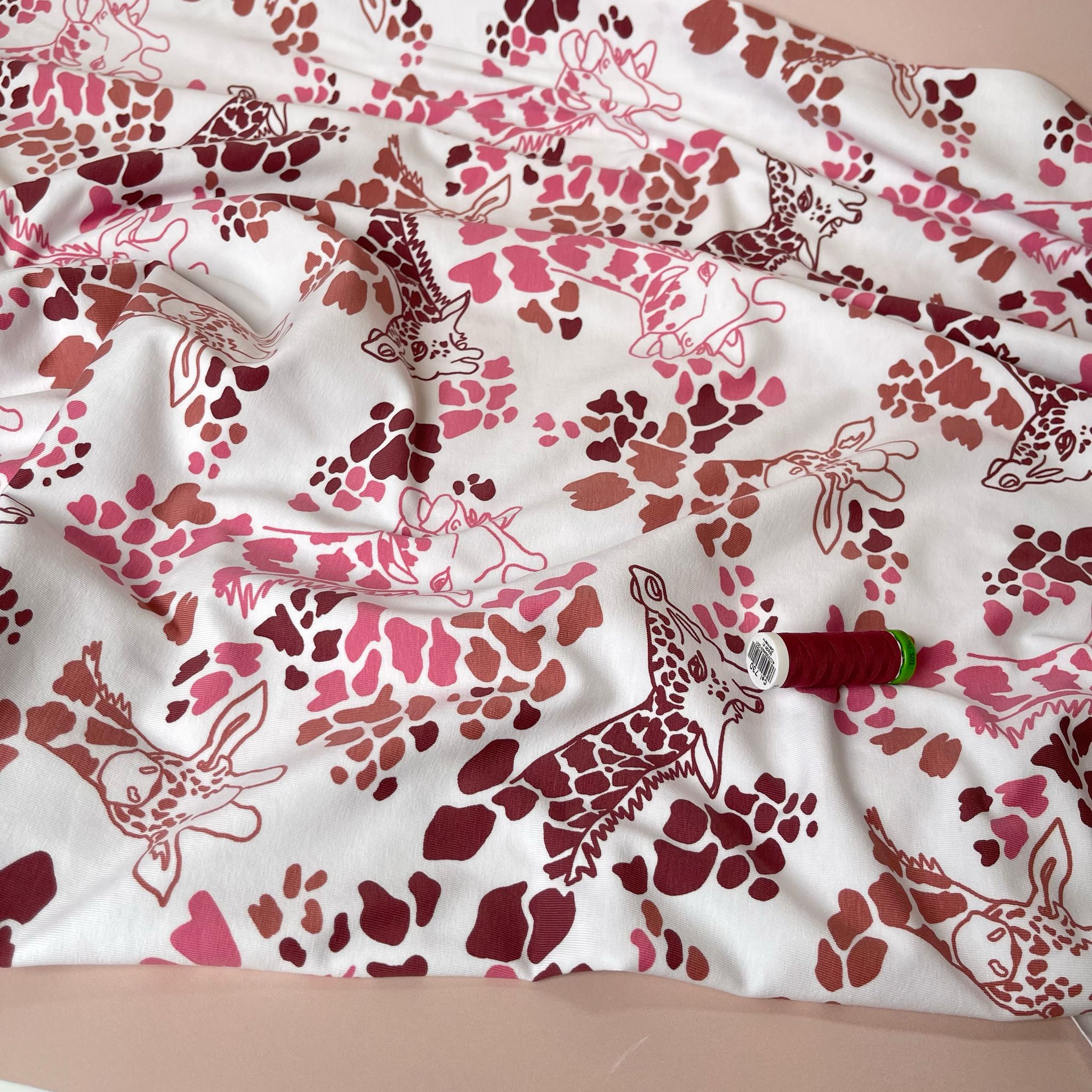 Giraffe's in Red Cotton Jersey Fabric