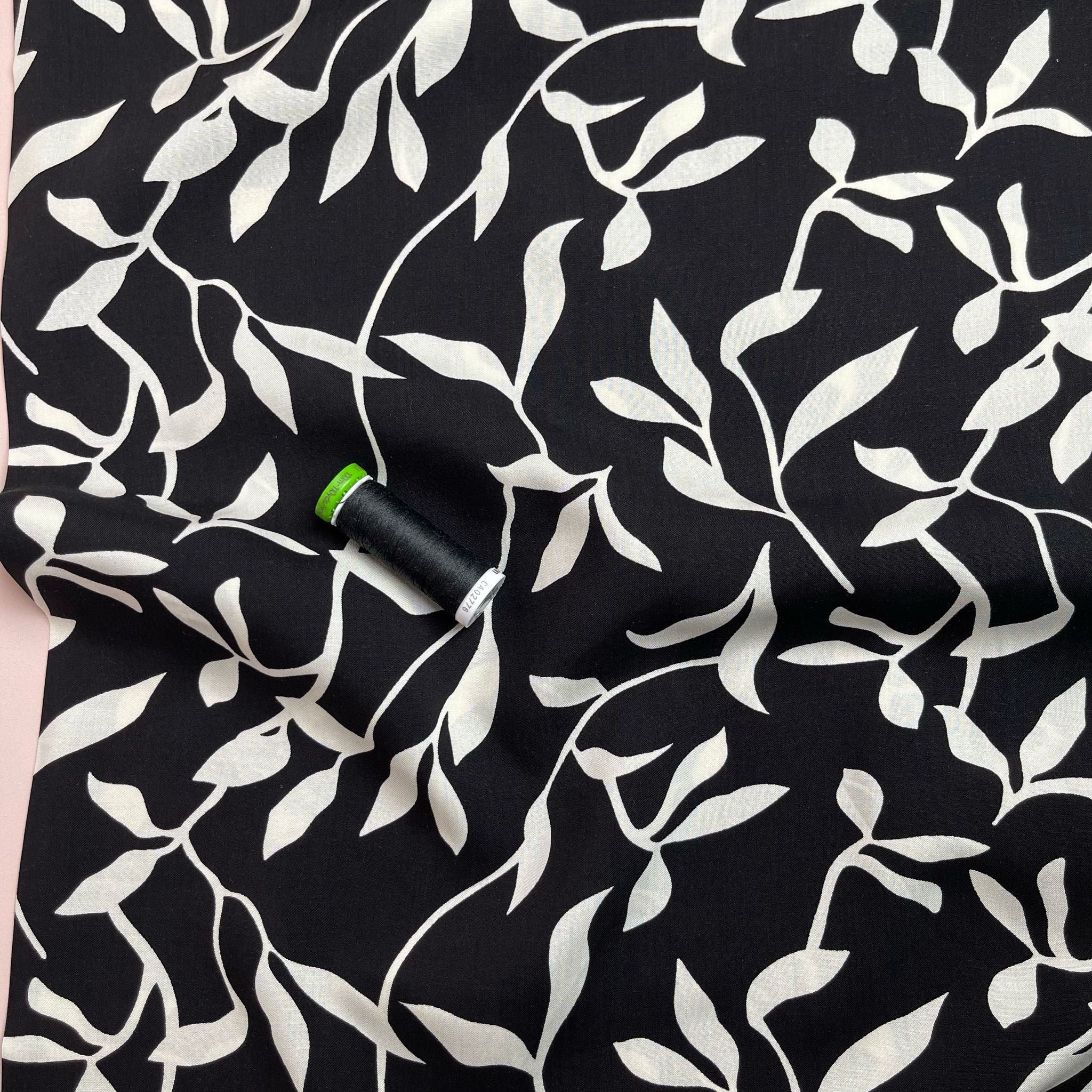 REMNANT 0.46 Metres - White Leaves on Black Viscose Fabric