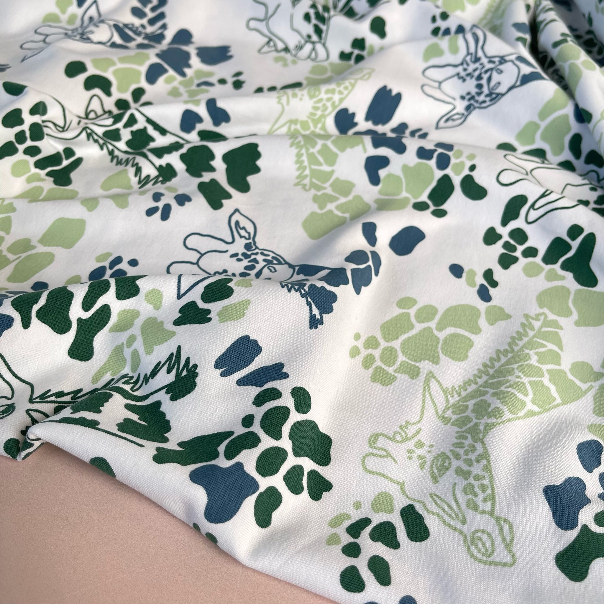 Giraffe's in Green Cotton Jersey Fabric
