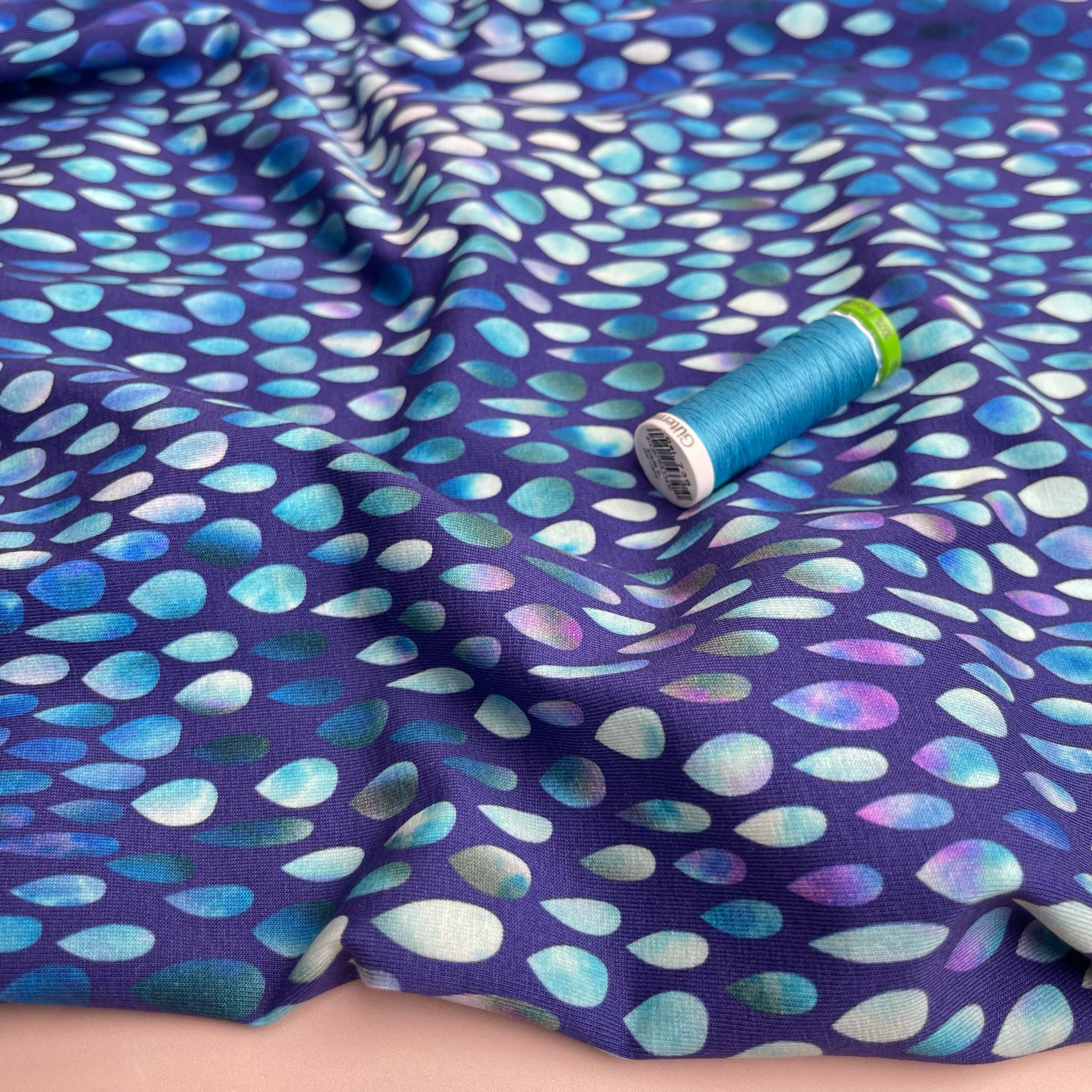 Danish Design - Iridescent Raindrops on Blue Cotton Jersey Fabric