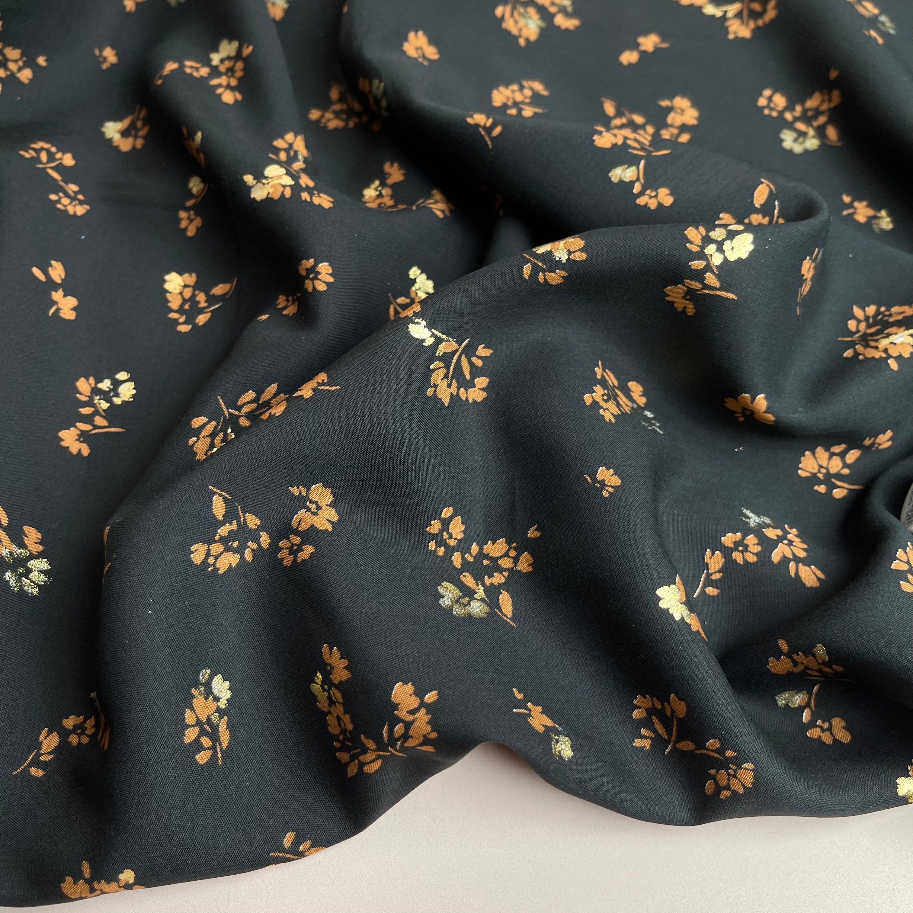 REMNANT 1 Metre (plus free section with fault) Sparkle Flowers on Black Viscose Fabric