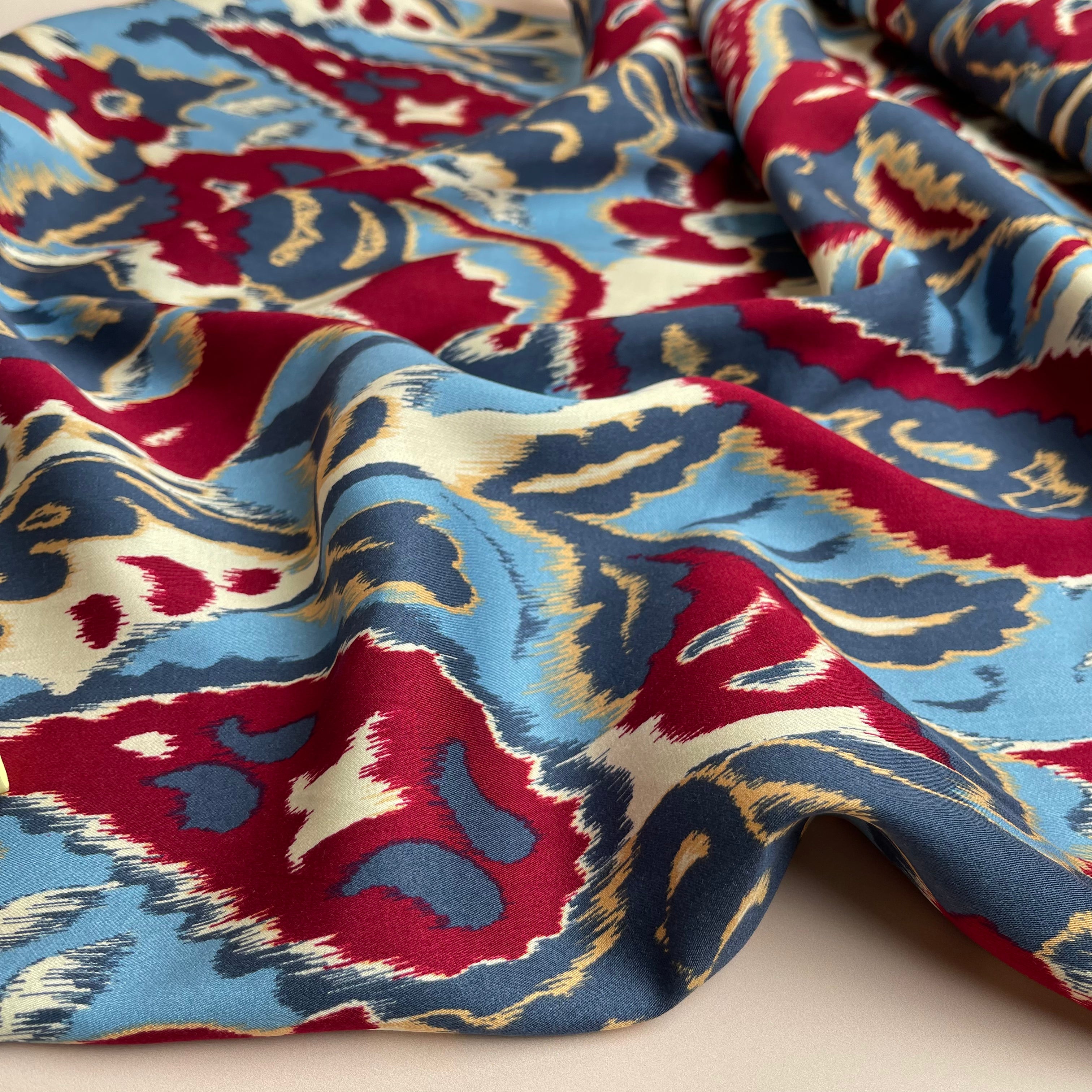 Hazy Paisley Blue and Red Viscose Sateen Fabric