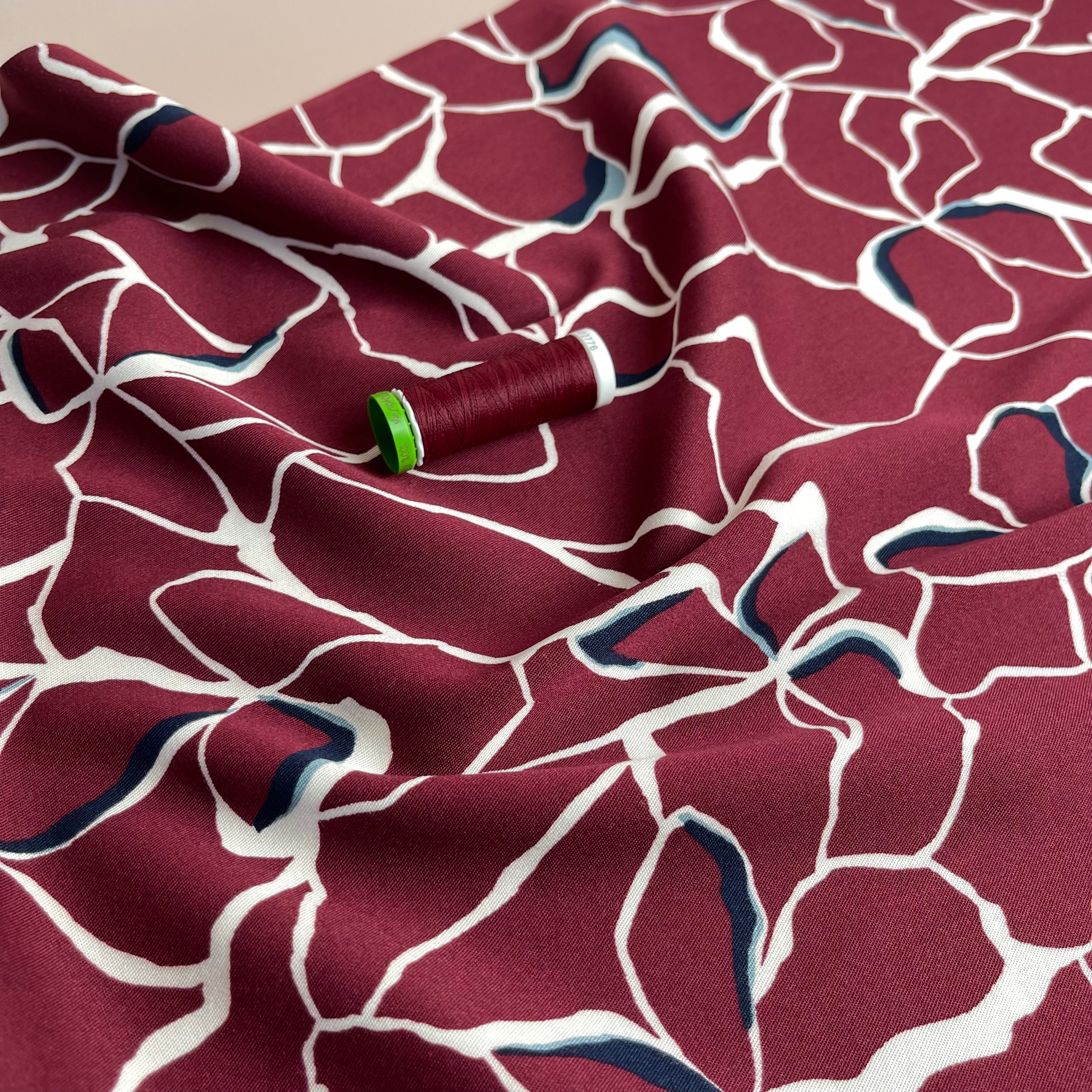 Rosella Line Flowers in Berry Stretch Viscose Twill Fabric