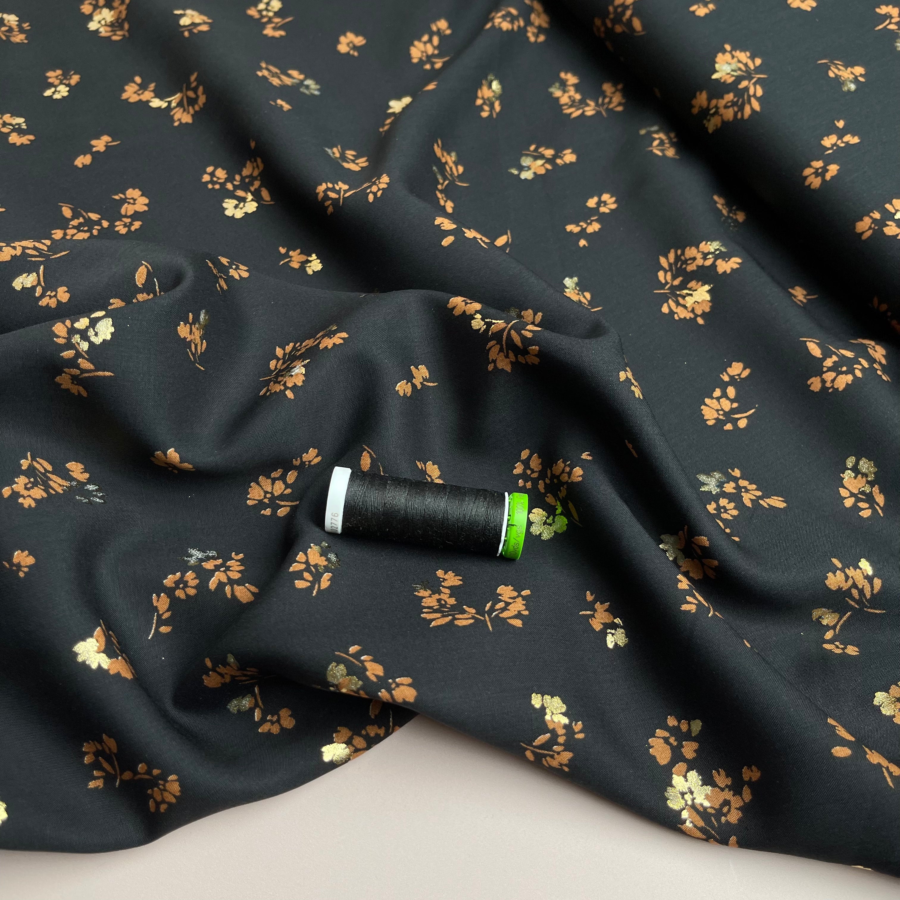 REMNANT 1 Metre (plus free section with fault) Sparkle Flowers on Black Viscose Fabric