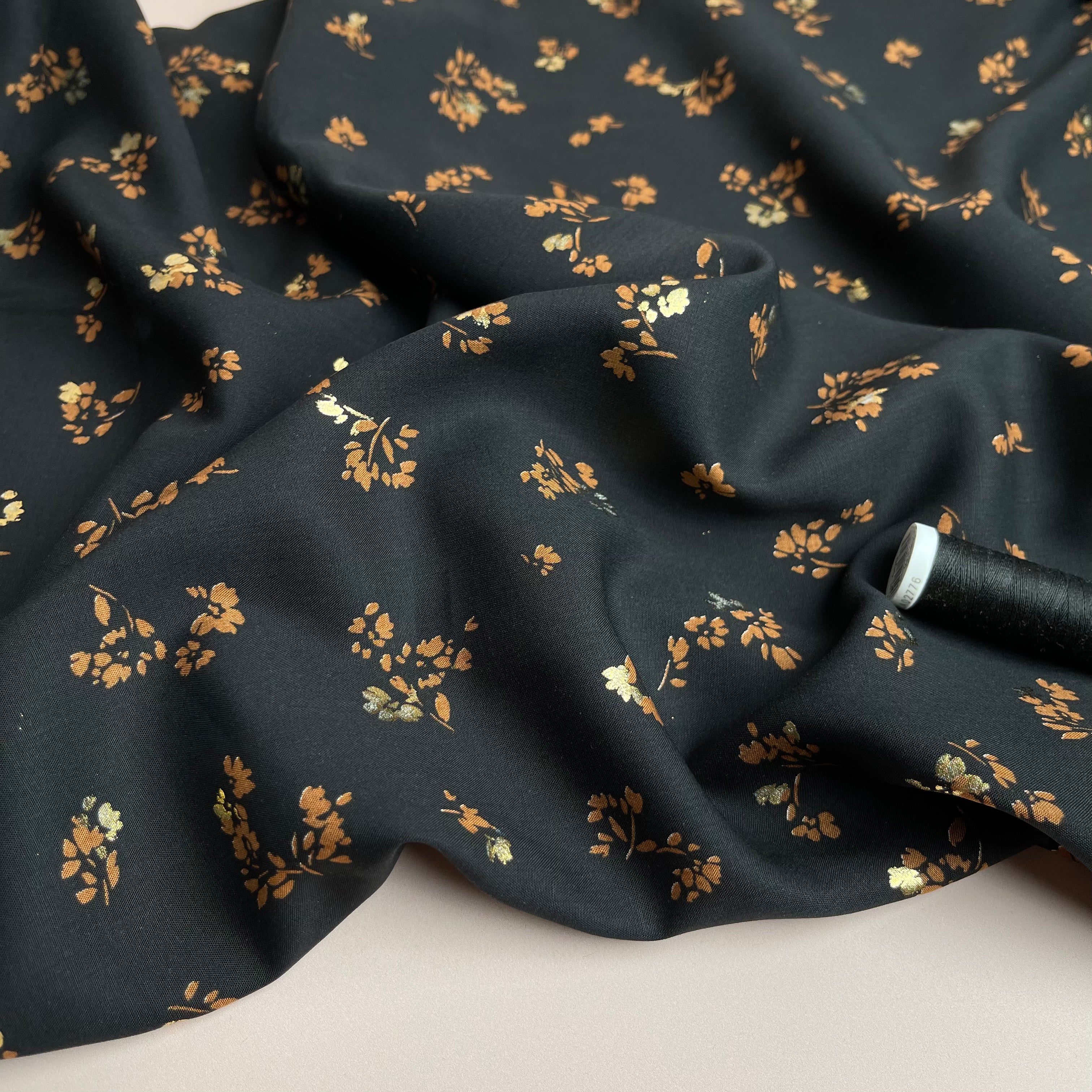 Sparkle Flowers on Black Viscose Fabric