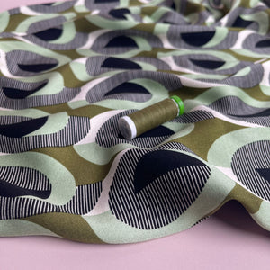 Abstract Circles on Olive Viscose Twill Sateen Fabric