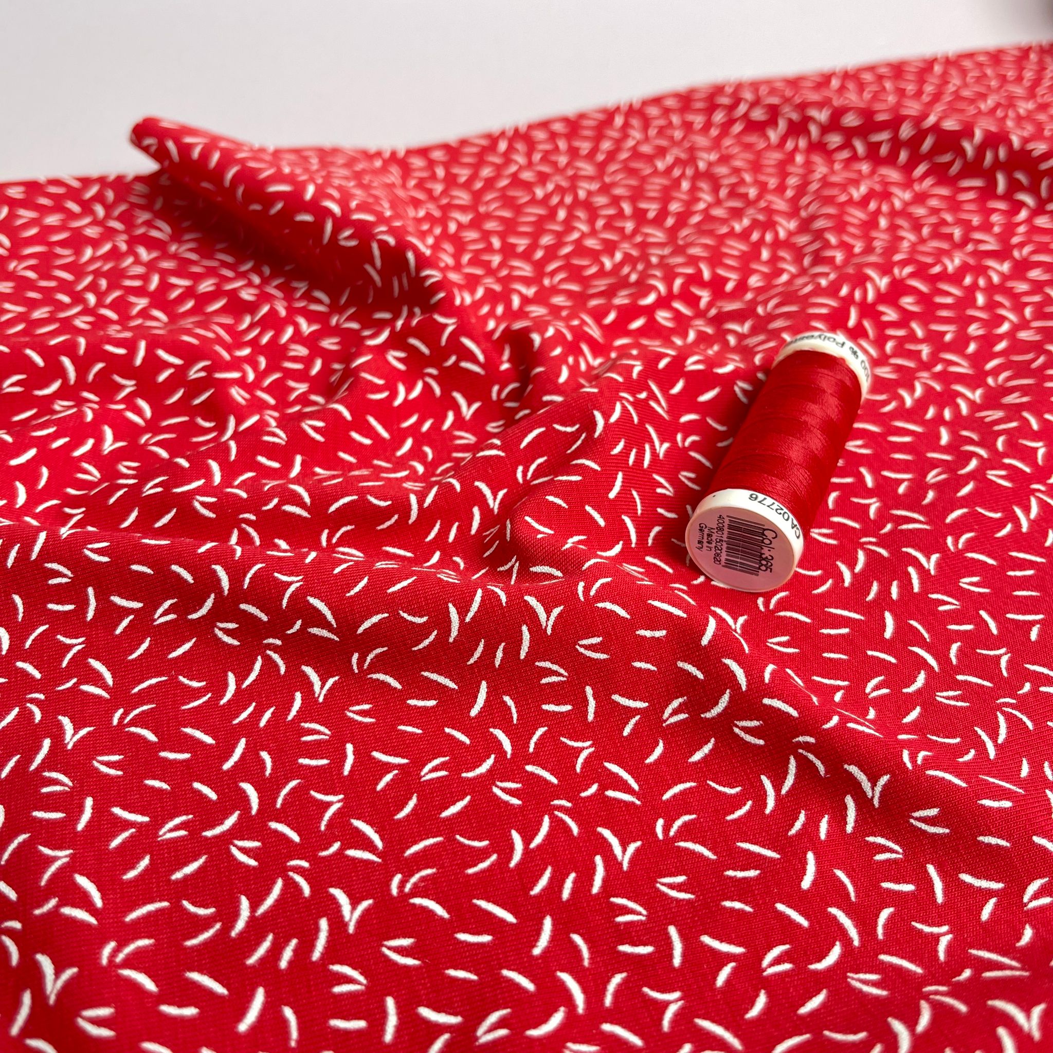 Dashes on Red Cotton Jersey Fabric