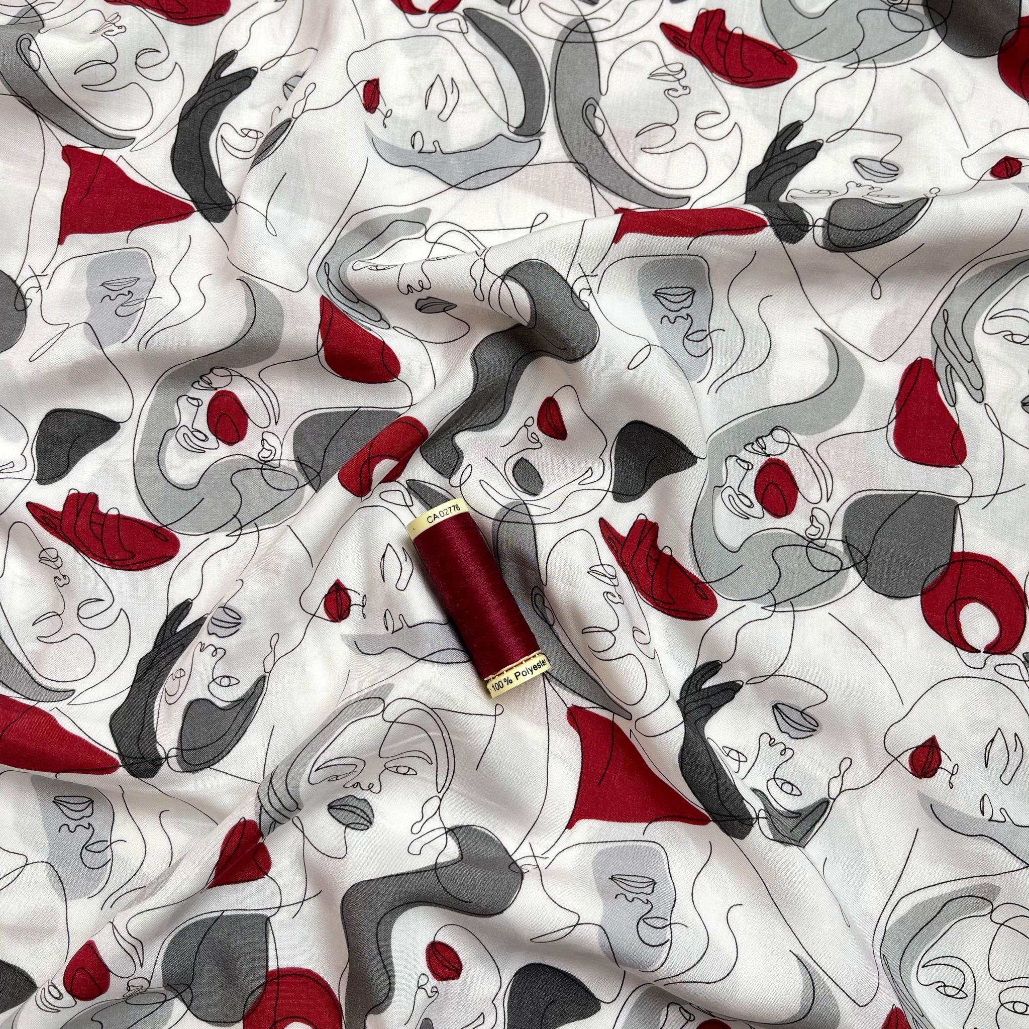 Faces on Grey Viscose Fabric