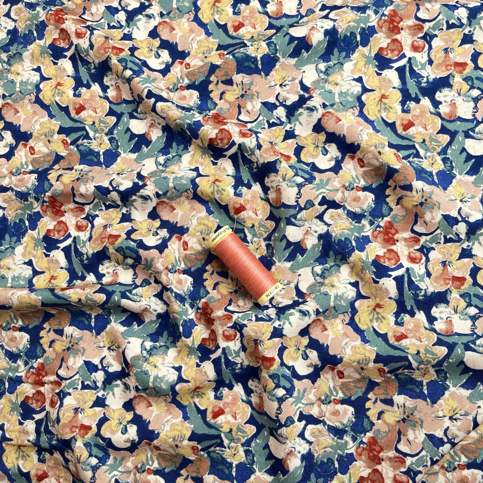 Soft Autumn Blossoms on Blue Viscose Fabric