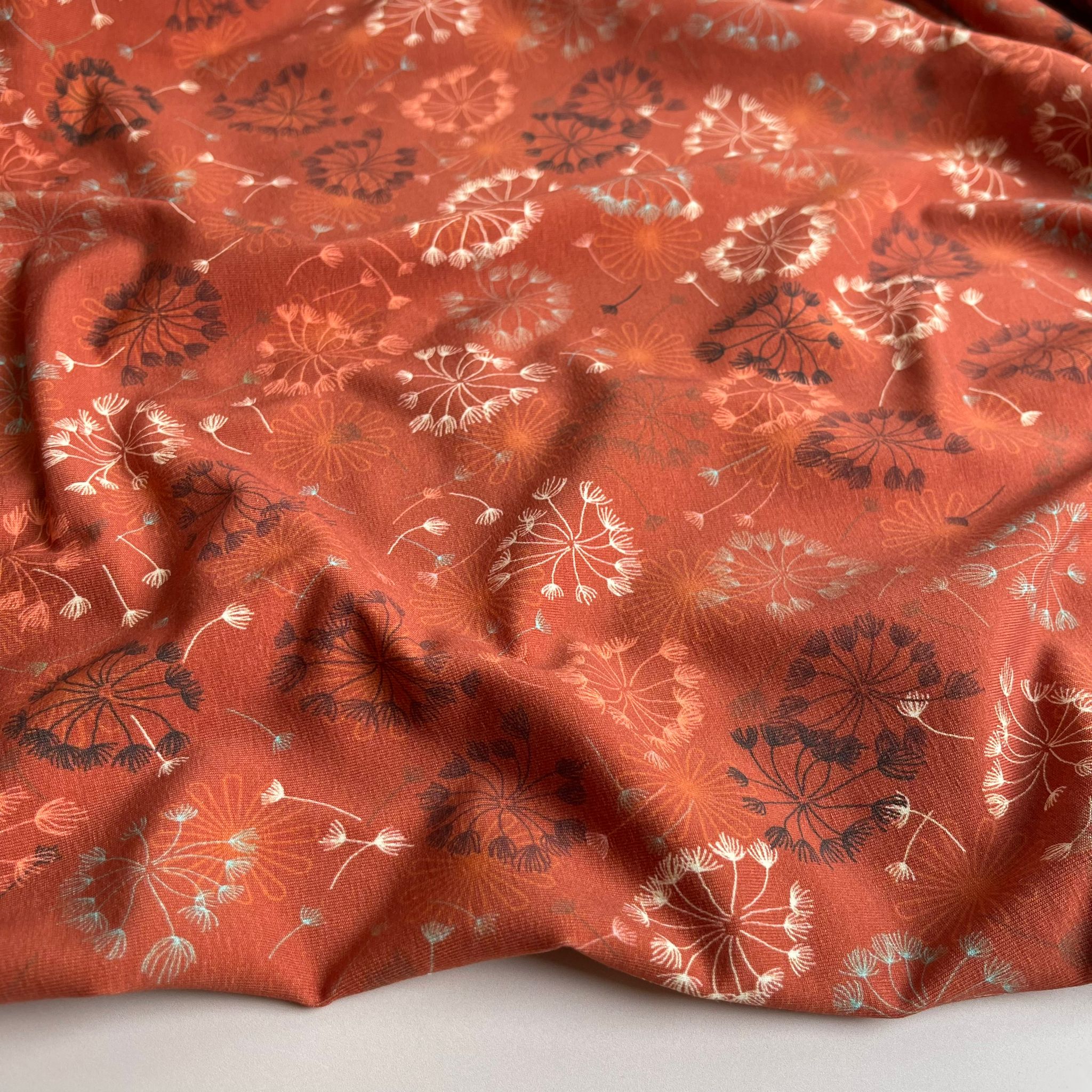 Danish Design - Dandelion on Rust Cotton Jersey Fabric