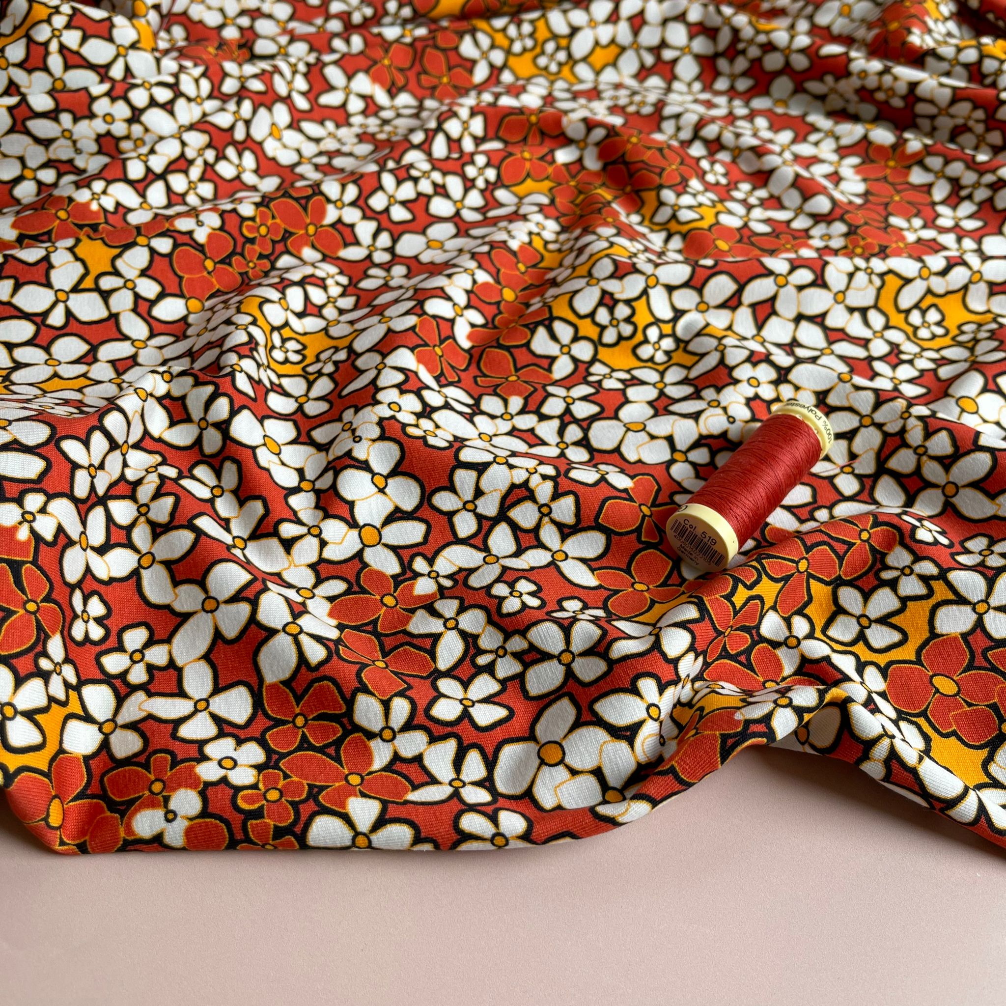 Danish Design - Small Retro Flowers on Burnt Orange Cotton Jersey Fabric