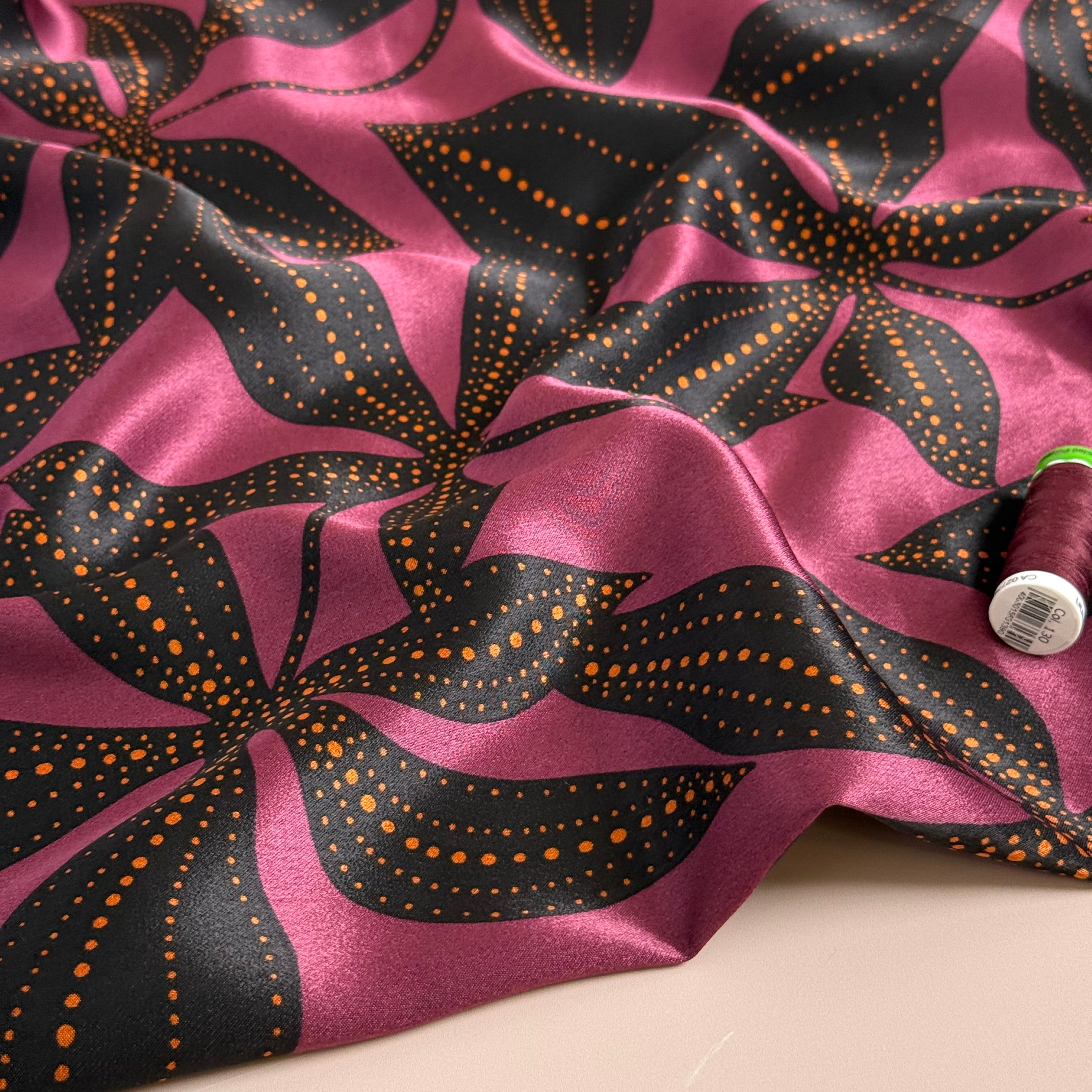 Spoty Flowers on Wine Spun Viscose Sateen Fabric