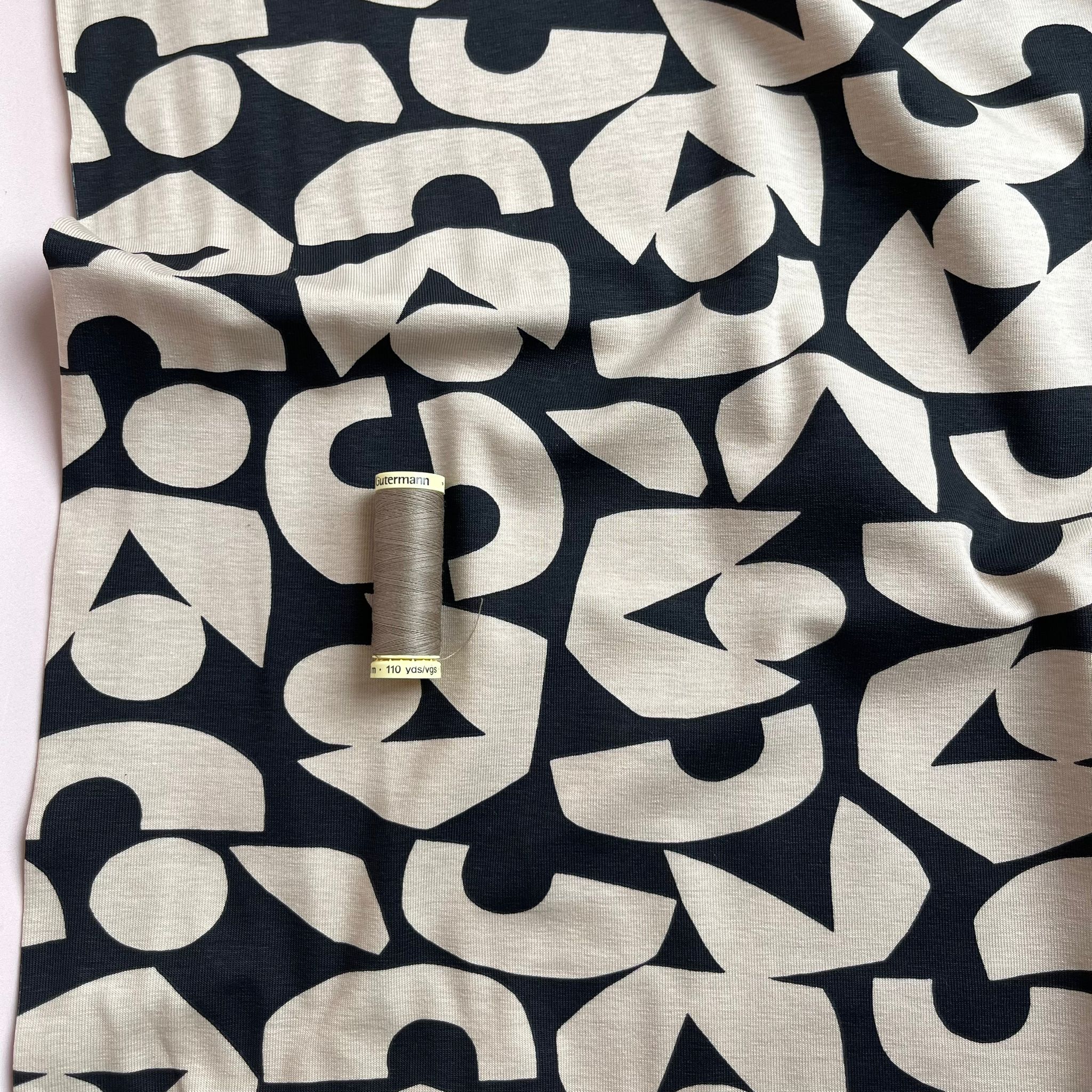 Cream Shapes on Black Combed Cotton Jersey Fabric
