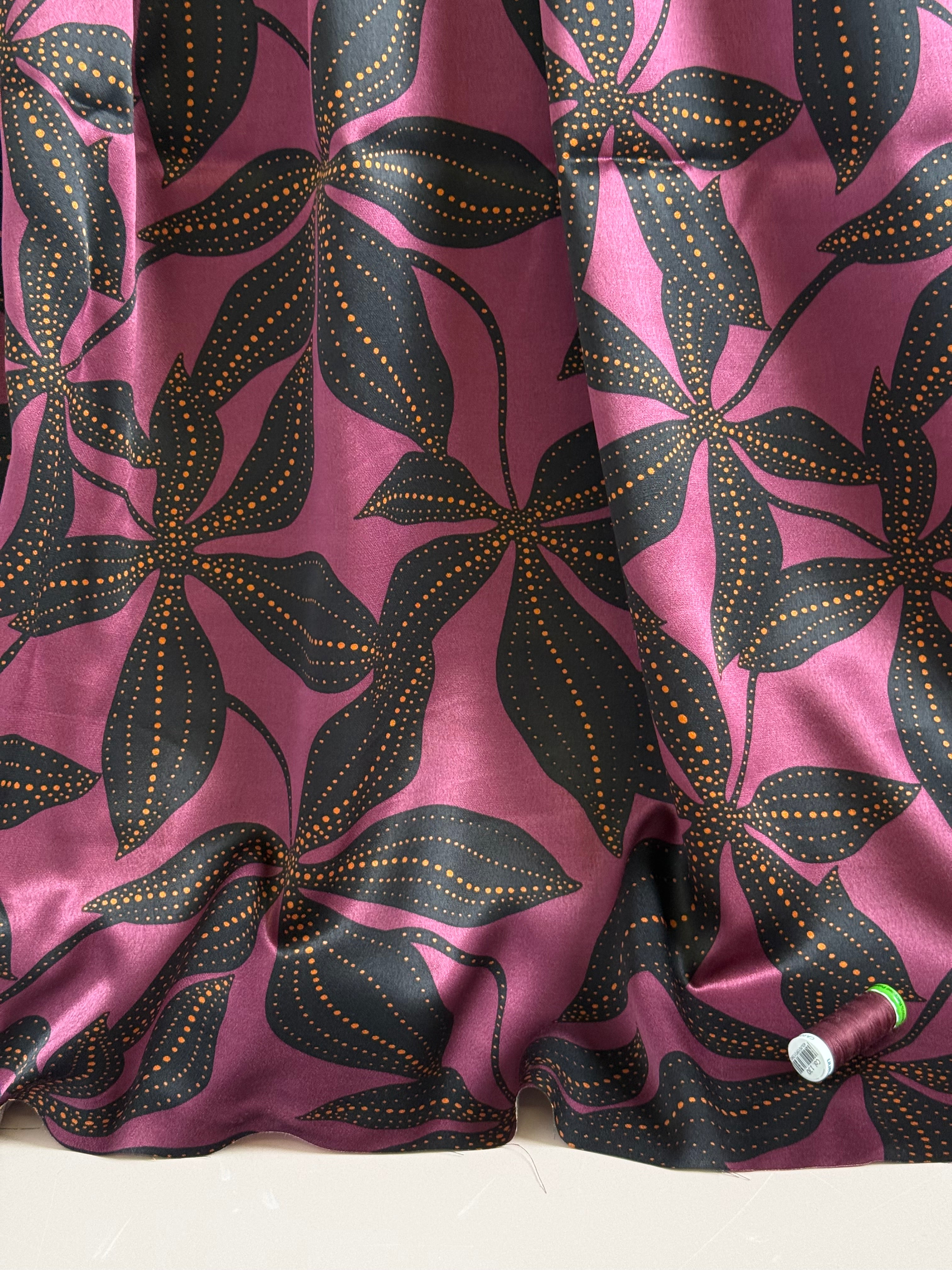 Spoty Flowers on Wine Spun Viscose Sateen Fabric