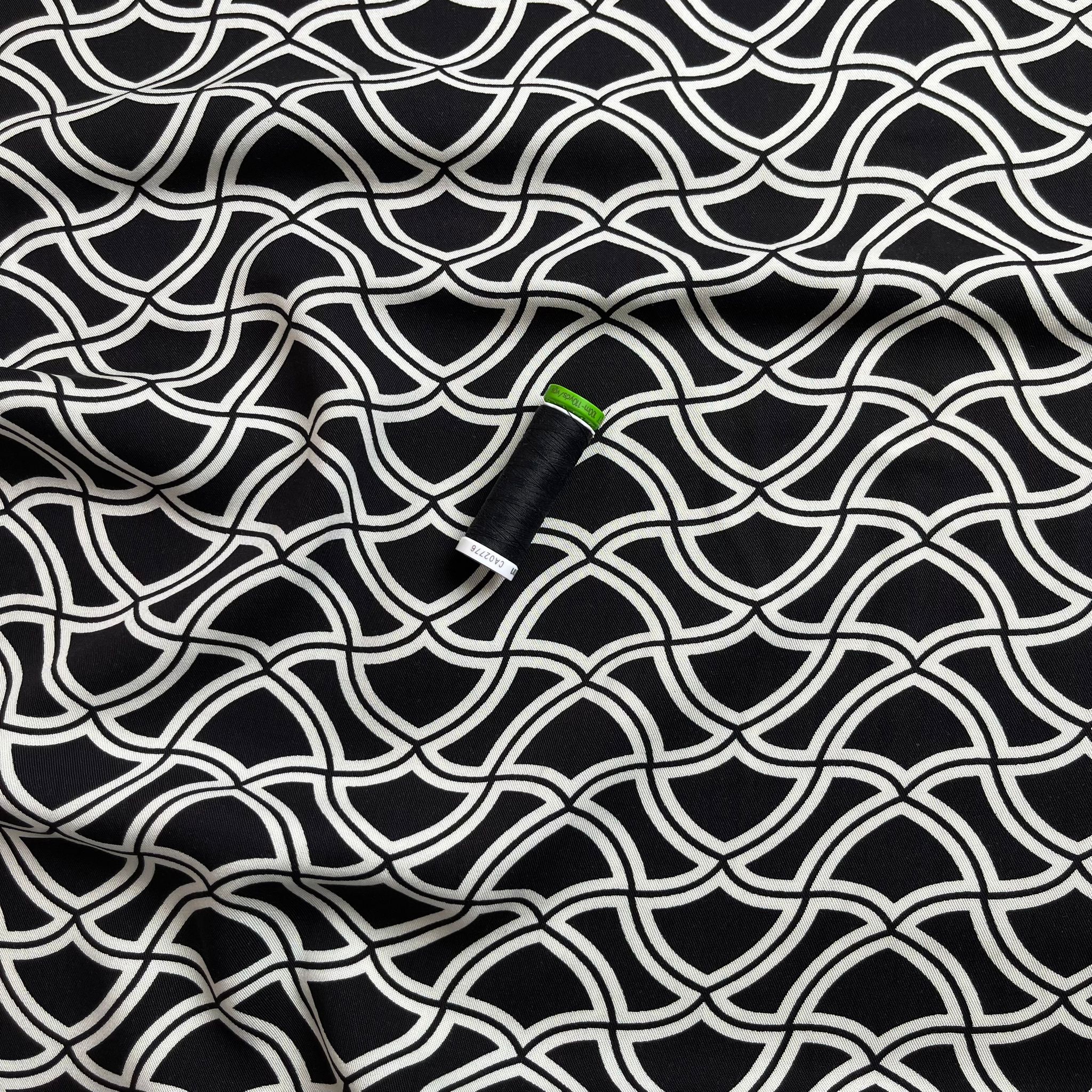 Abstract Waves on Black Viscose Twill Fabric